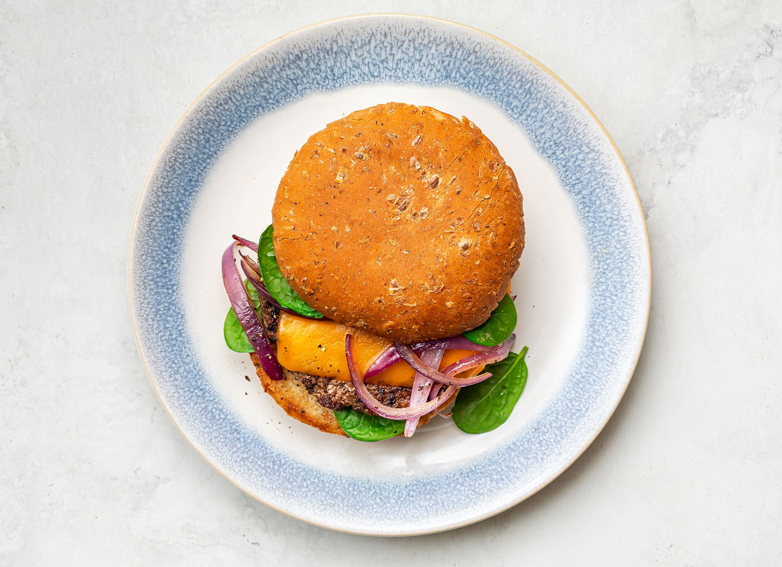 Cheeseburger with Sautéed Onions with Sprouted Whole Grain Burger Buns