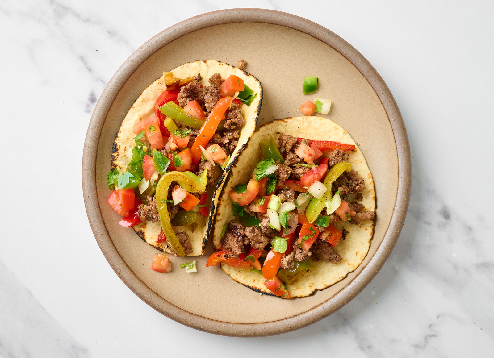 Ground Beef Tacos with Salsa on Flour Tortillas