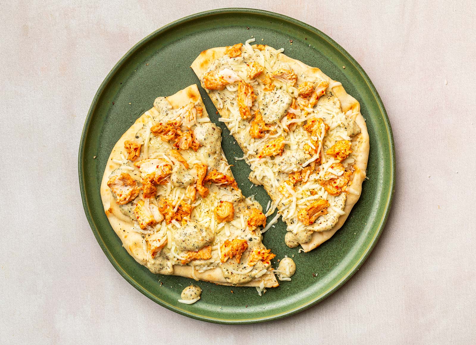 Cheesy Spinach Artichoke Chicken Naan Pizza with Shredded Mozzarella Cheese