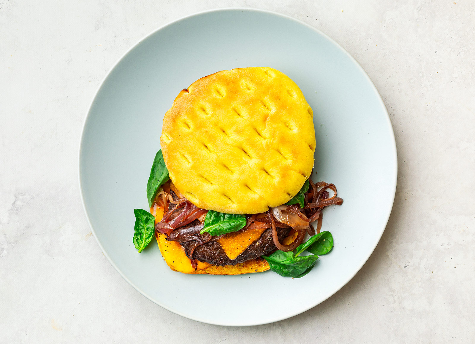Juicy Caramelized Onion Cheeseburger on Brioche Thin Buns