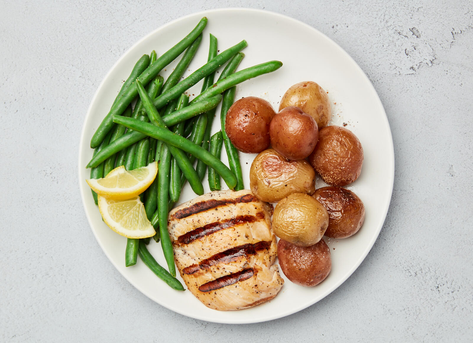 Pork Chops + Roasted Potatoes with Lemony Beans