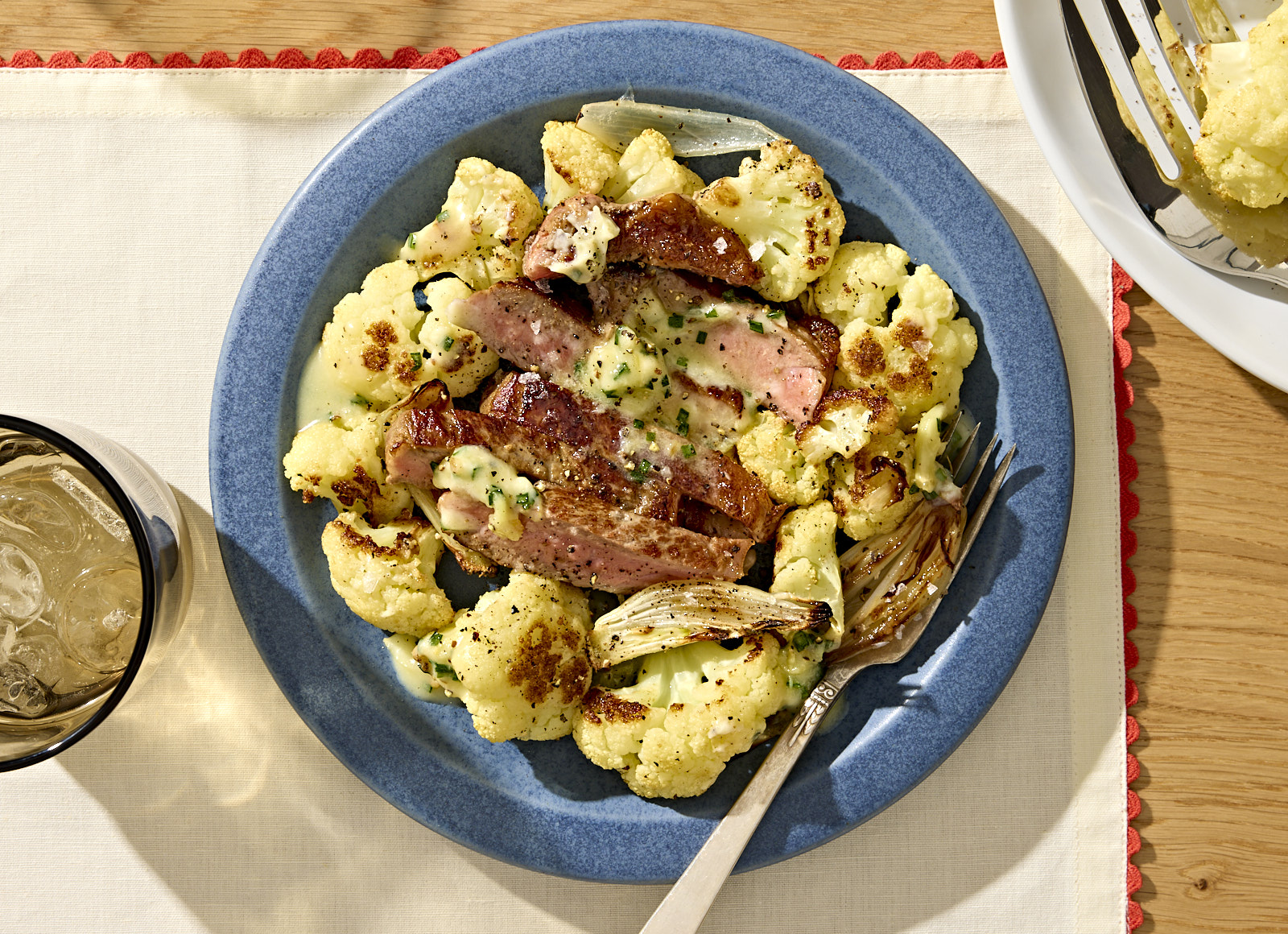 America's Test Kitchen Strip Steaks with Cauliflower + Roasted Garlic Butter