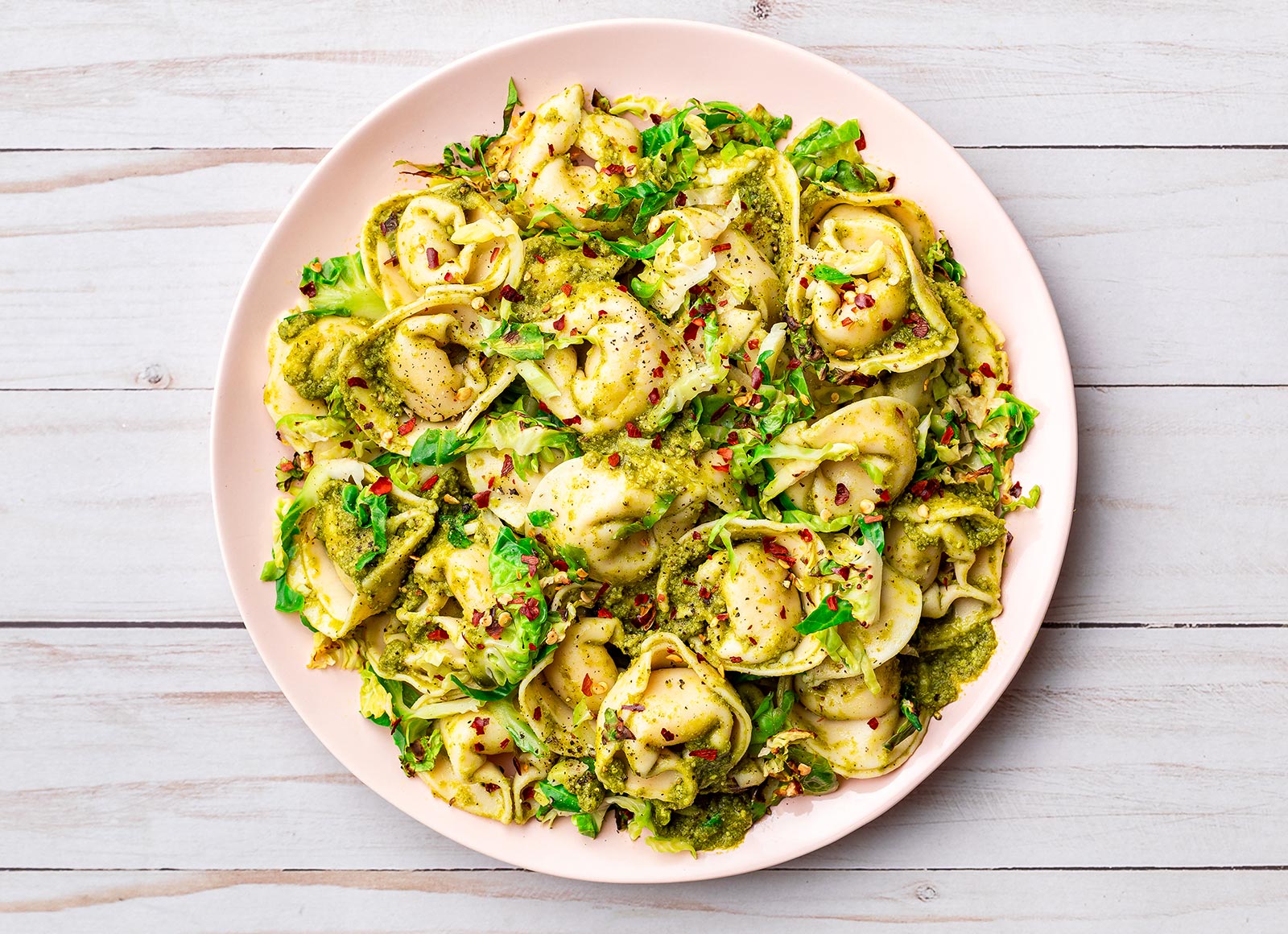 Basil Pesto Tortelloni with Crispy Brussels