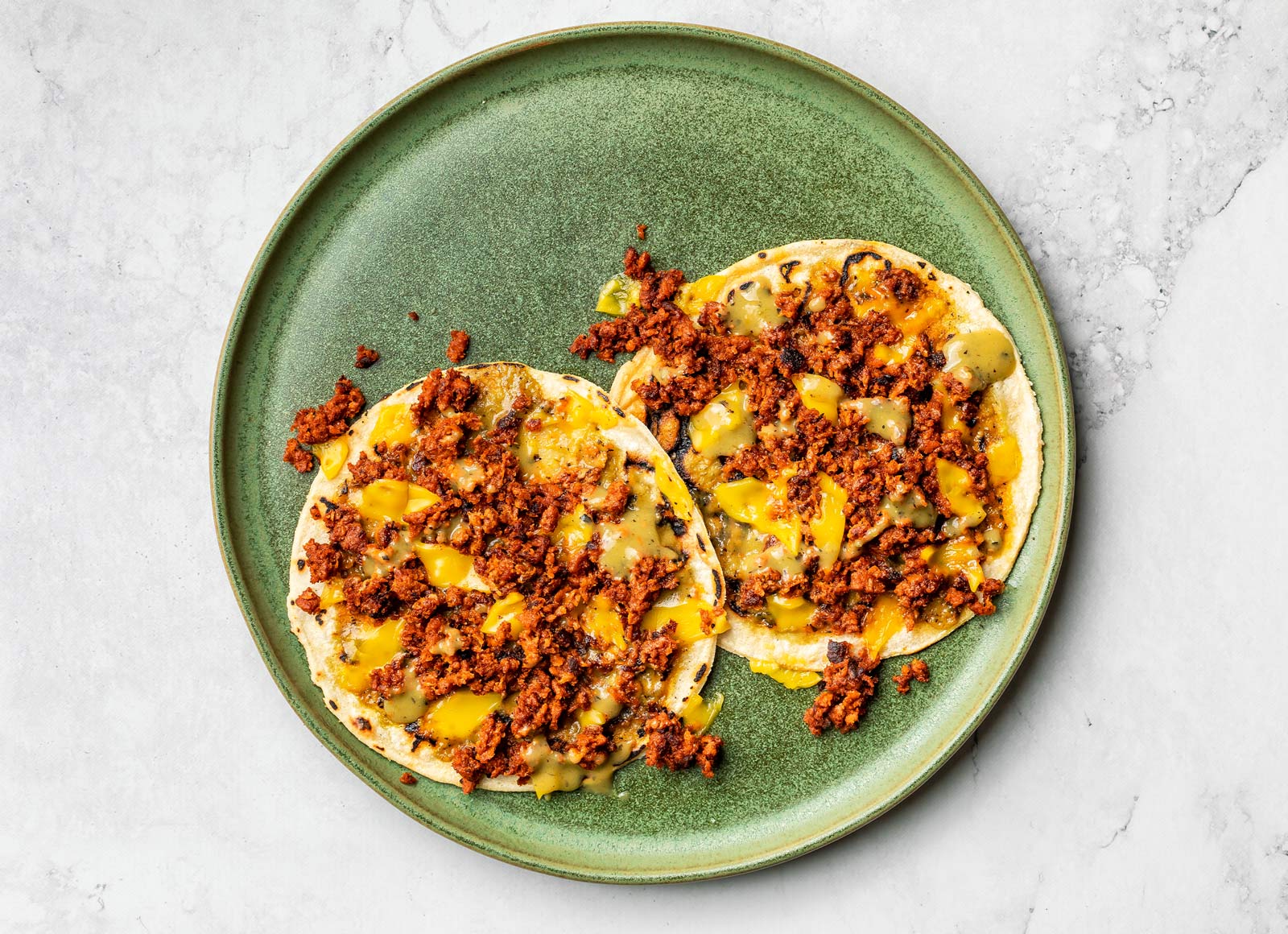 Plant-Based Chorizo, Green Chile + Cheddar Tostada