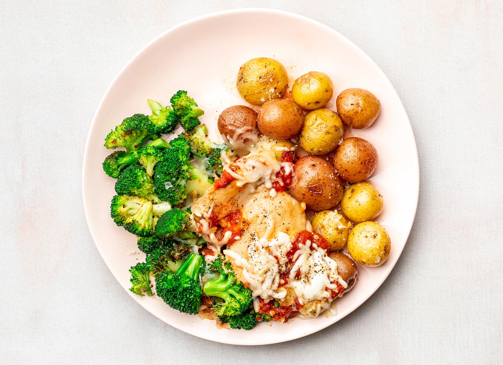Marinara Chicken Thighs + Roasted Potatoes with Broccoli Florets