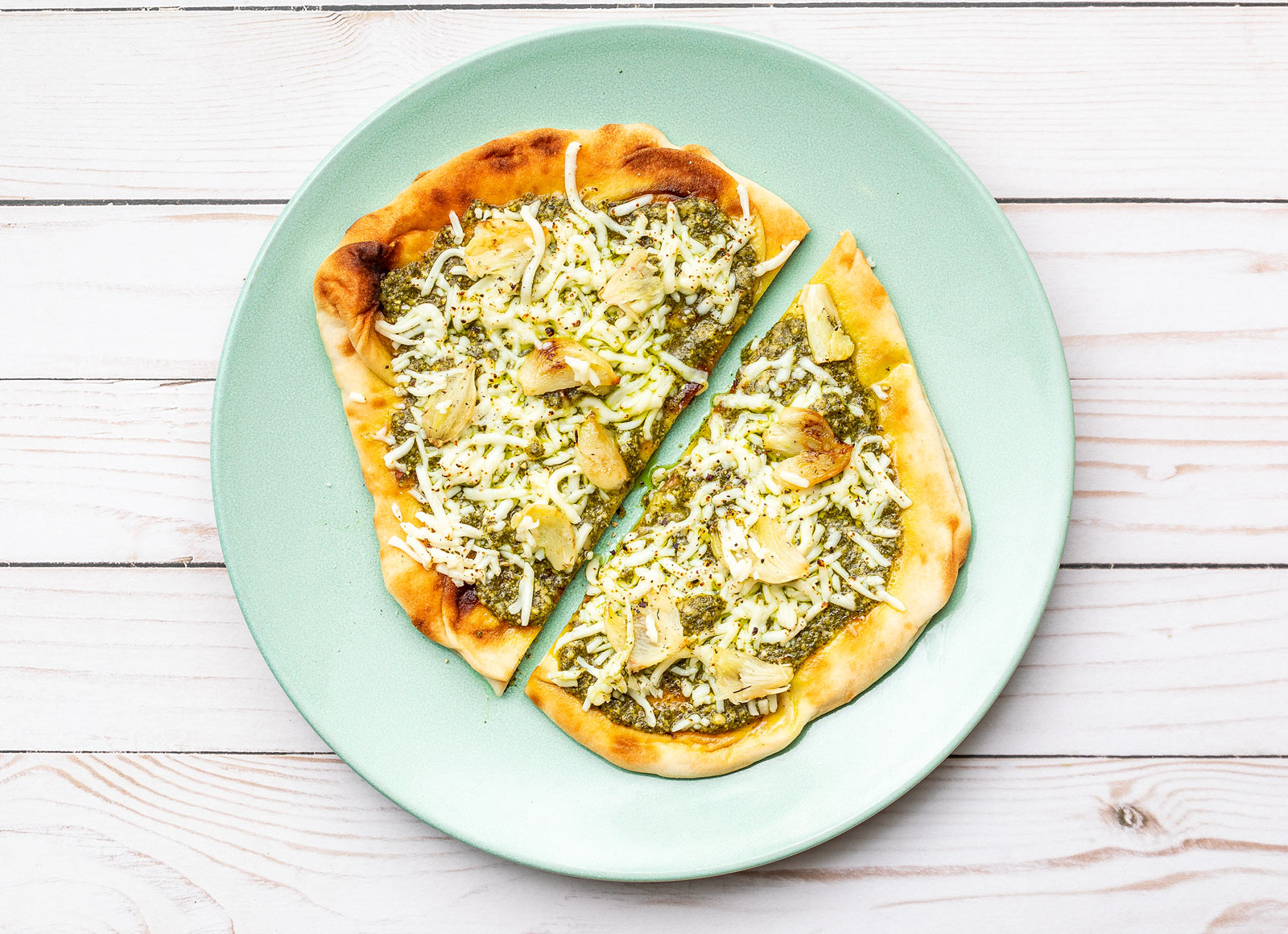 Roasted Garlic Pesto Naan Pizza with Shredded Mozzarella Cheese