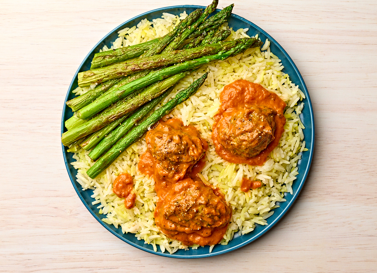 Butter Chicken Meatballs + Rice with Asparagus