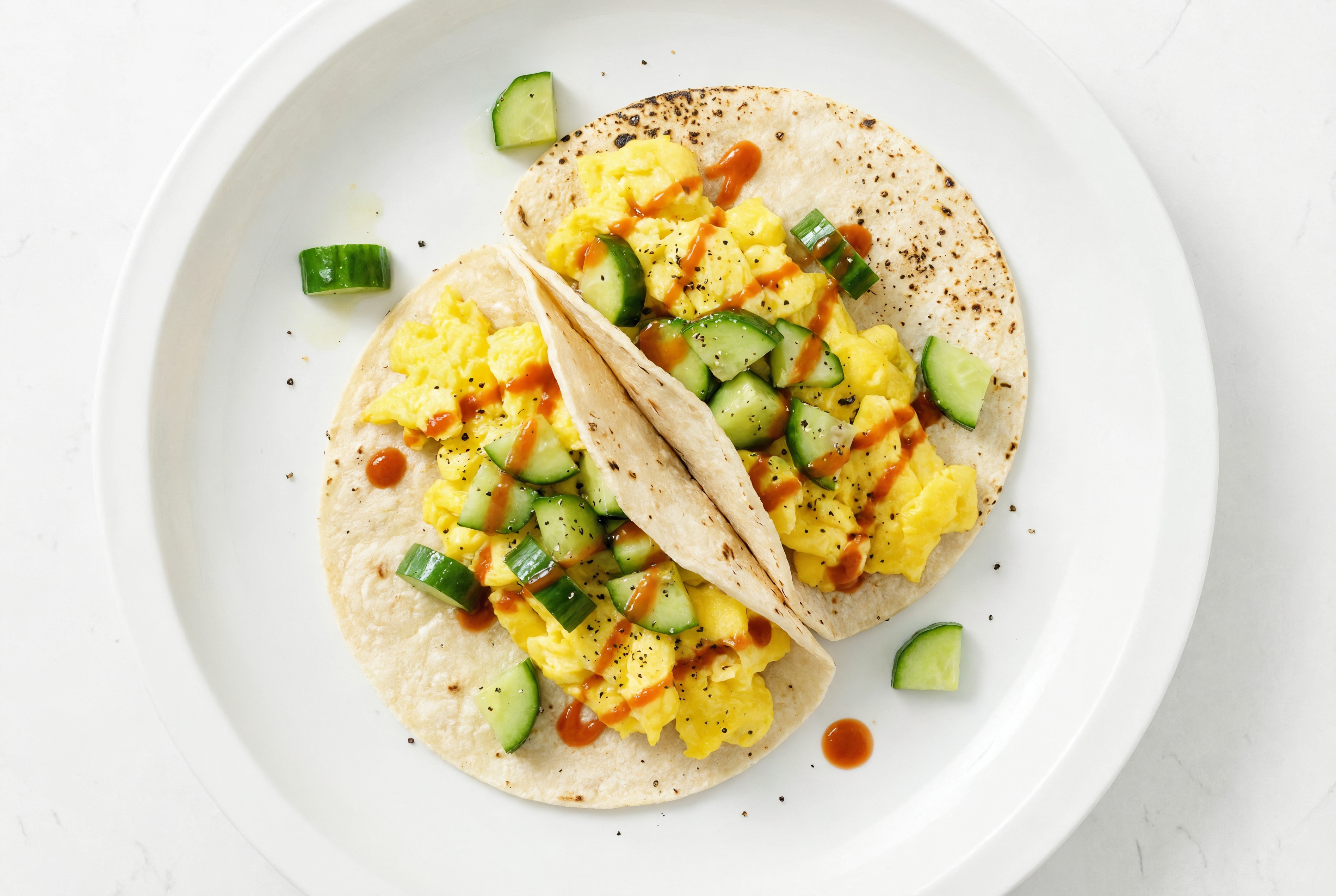 Spicy Egg Tacos with Fresh Cucumber Salsa with Sriracha Hot Sauce