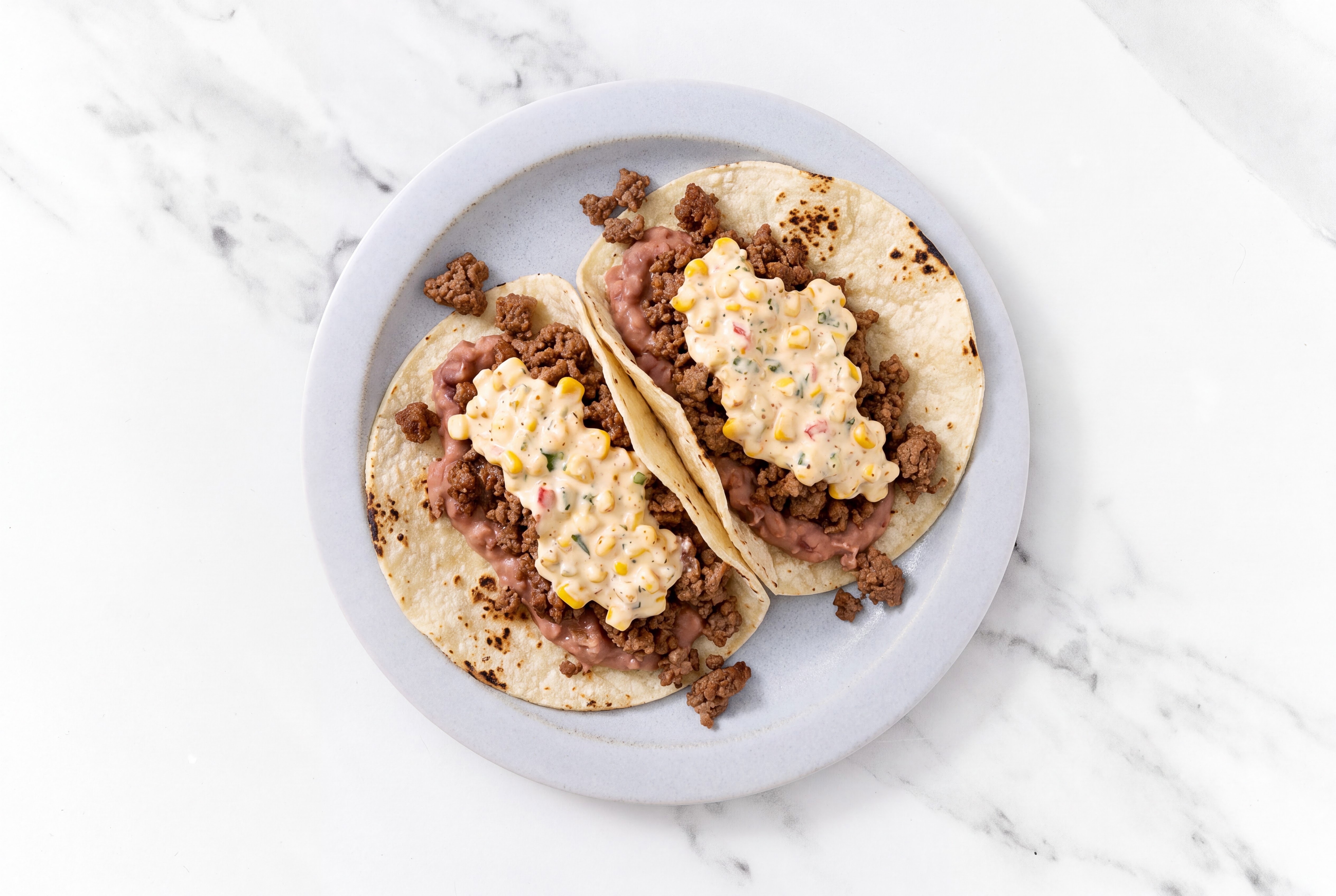 Ground 93/7 Lean Beef Tacos with Street White Corn Tortillas Sauce & Refried Red Beans