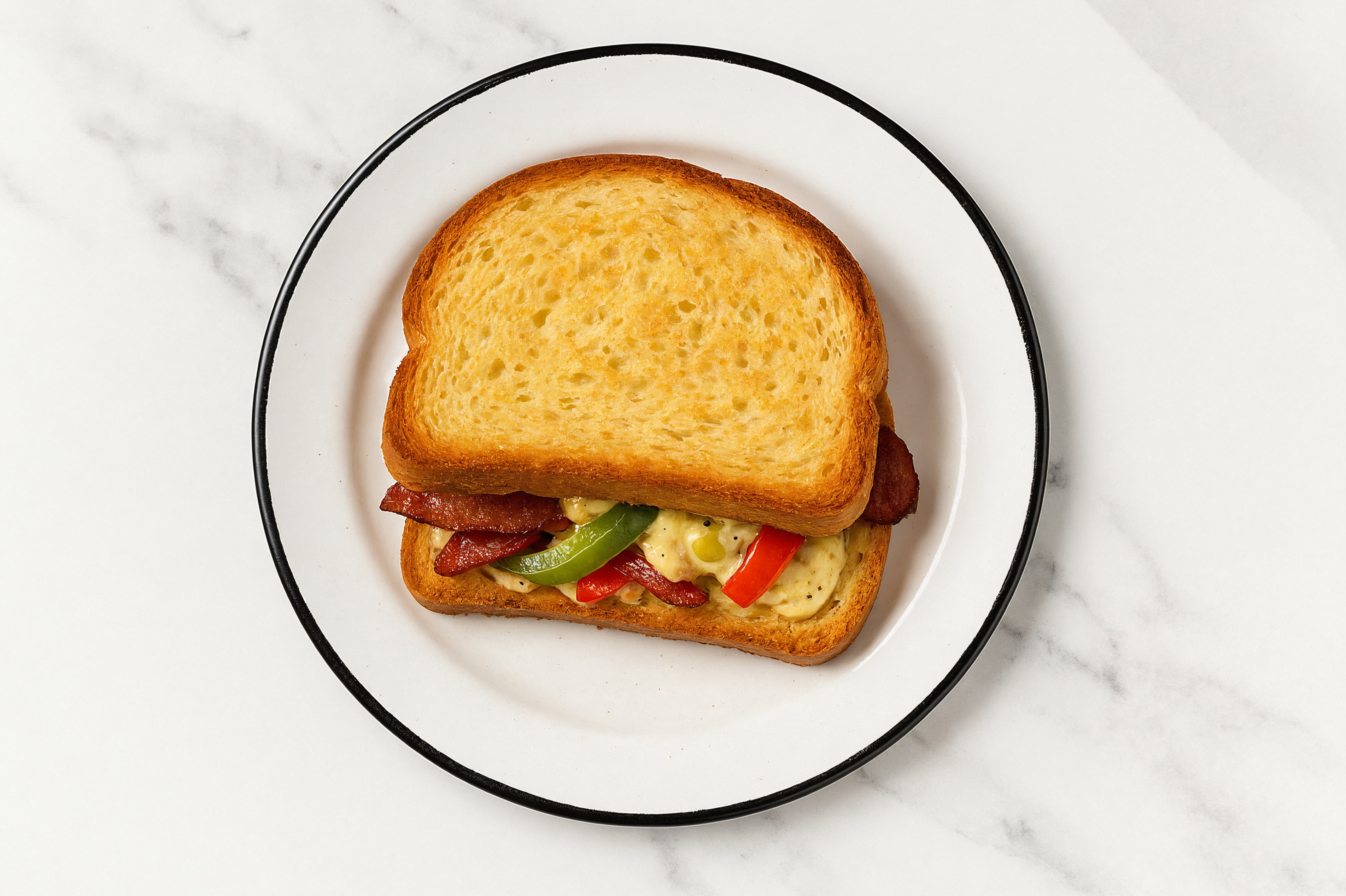 Street Corn Turkey Bacon Sandwich with Peppers + Onion on Honey White Bread