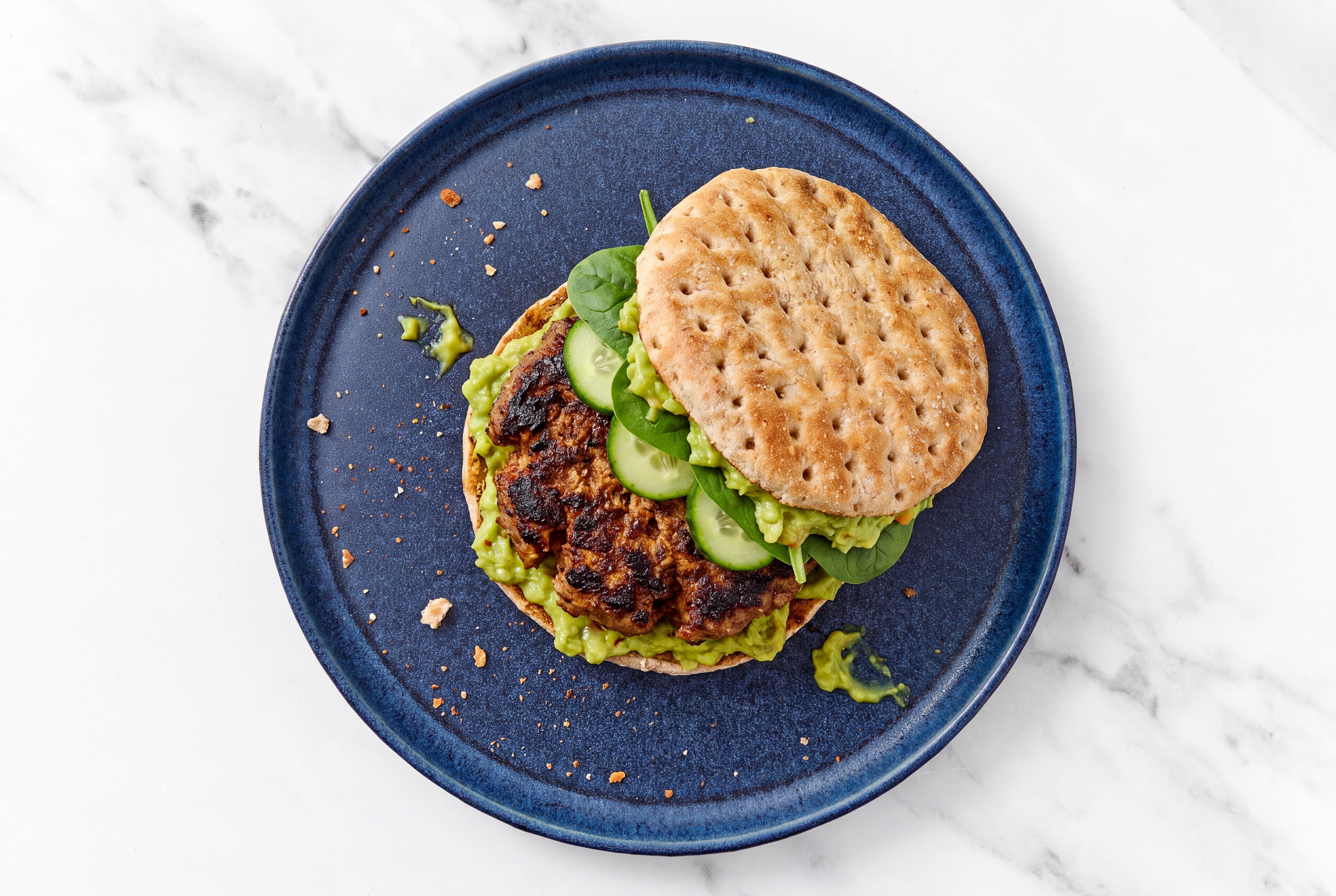 Grilled Blackened Beef Guacamole Burger with Baby Spinach