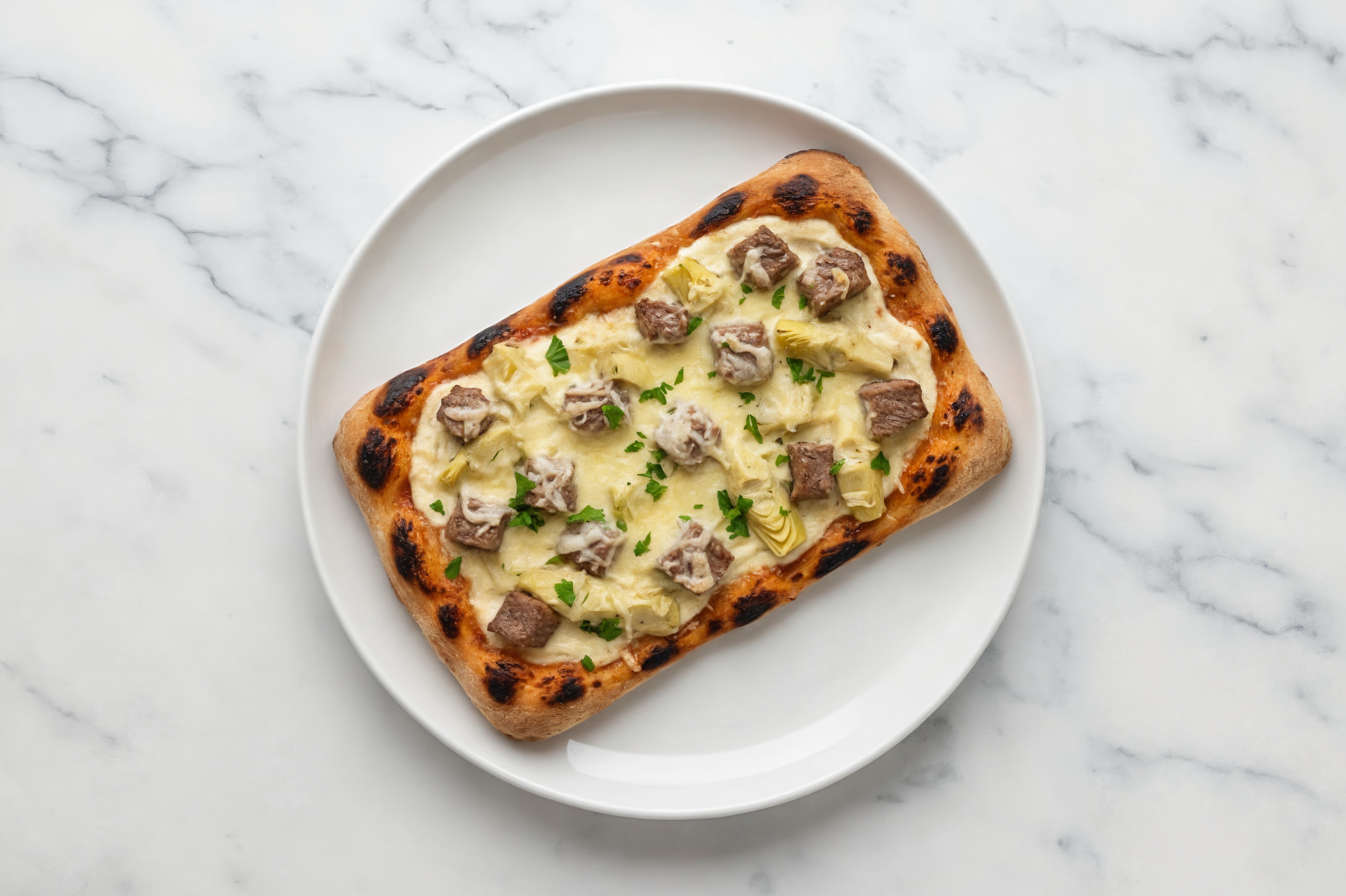Cheesy Sirloin + Artichoke Pizza with Parsley