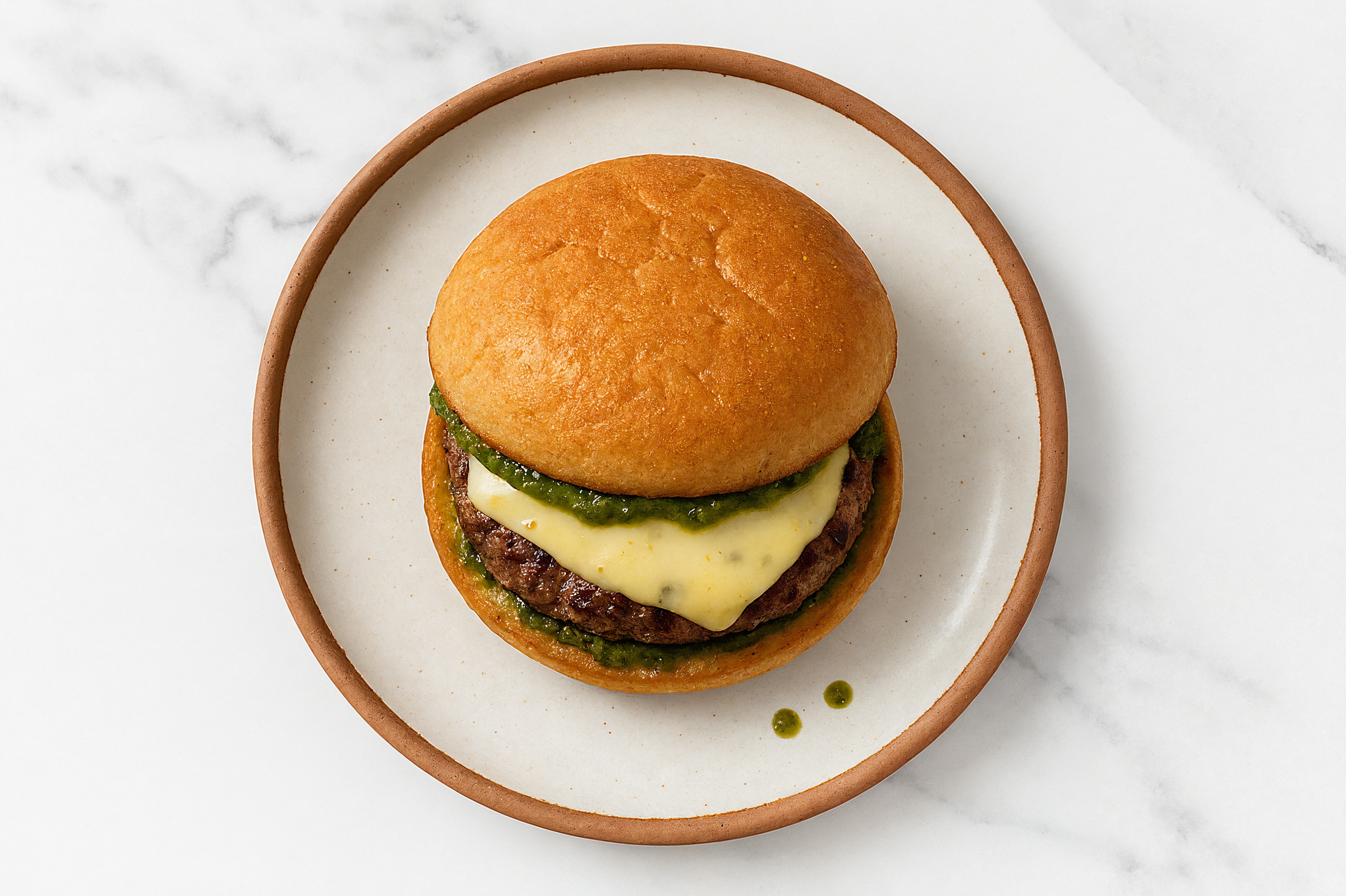 Ground Lamb Burger on Gluten-Free Bun with Pesto & Pepper Jack