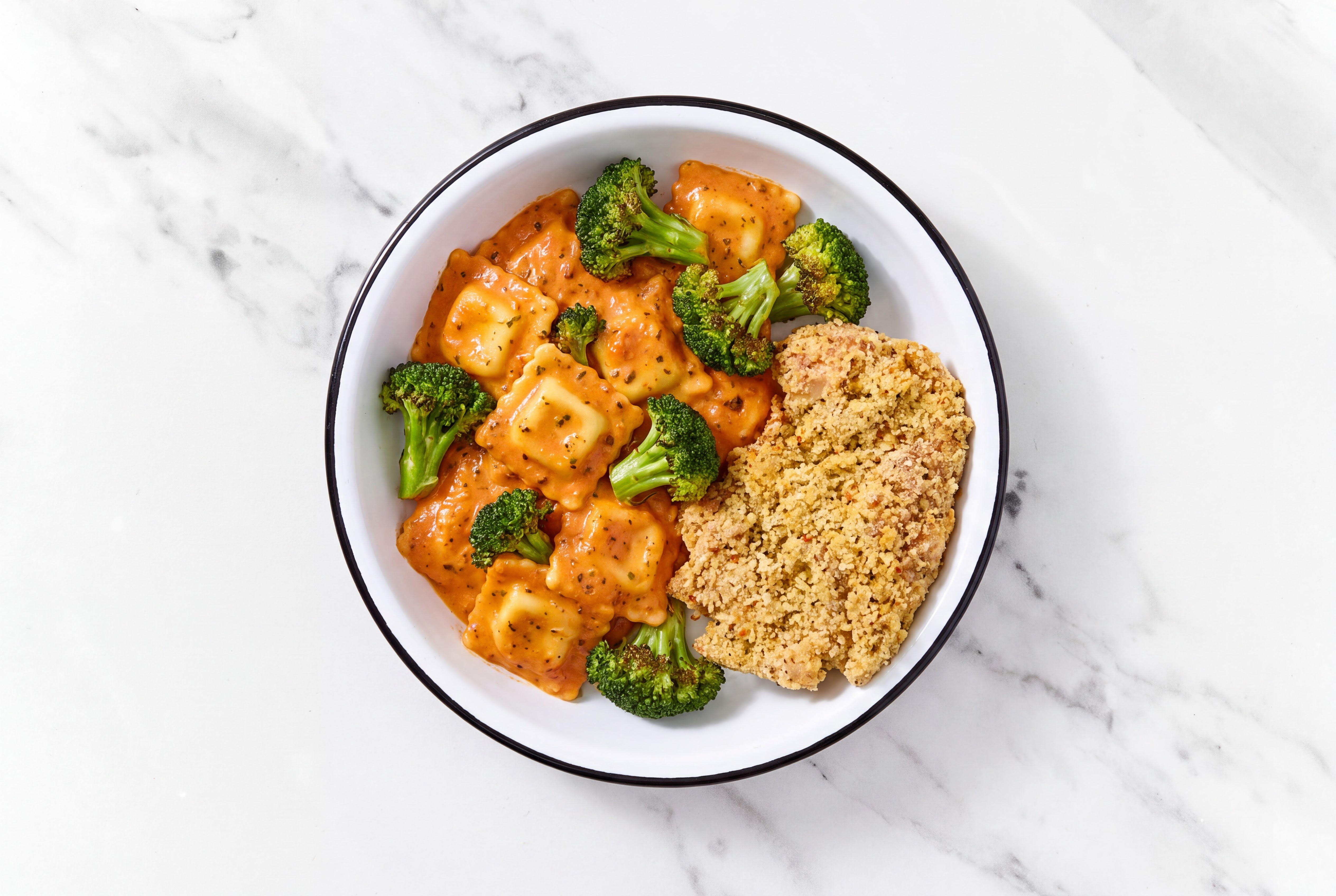 Crispy Garlic Chicken over Creamy Vodka Ravioli with Broccoli