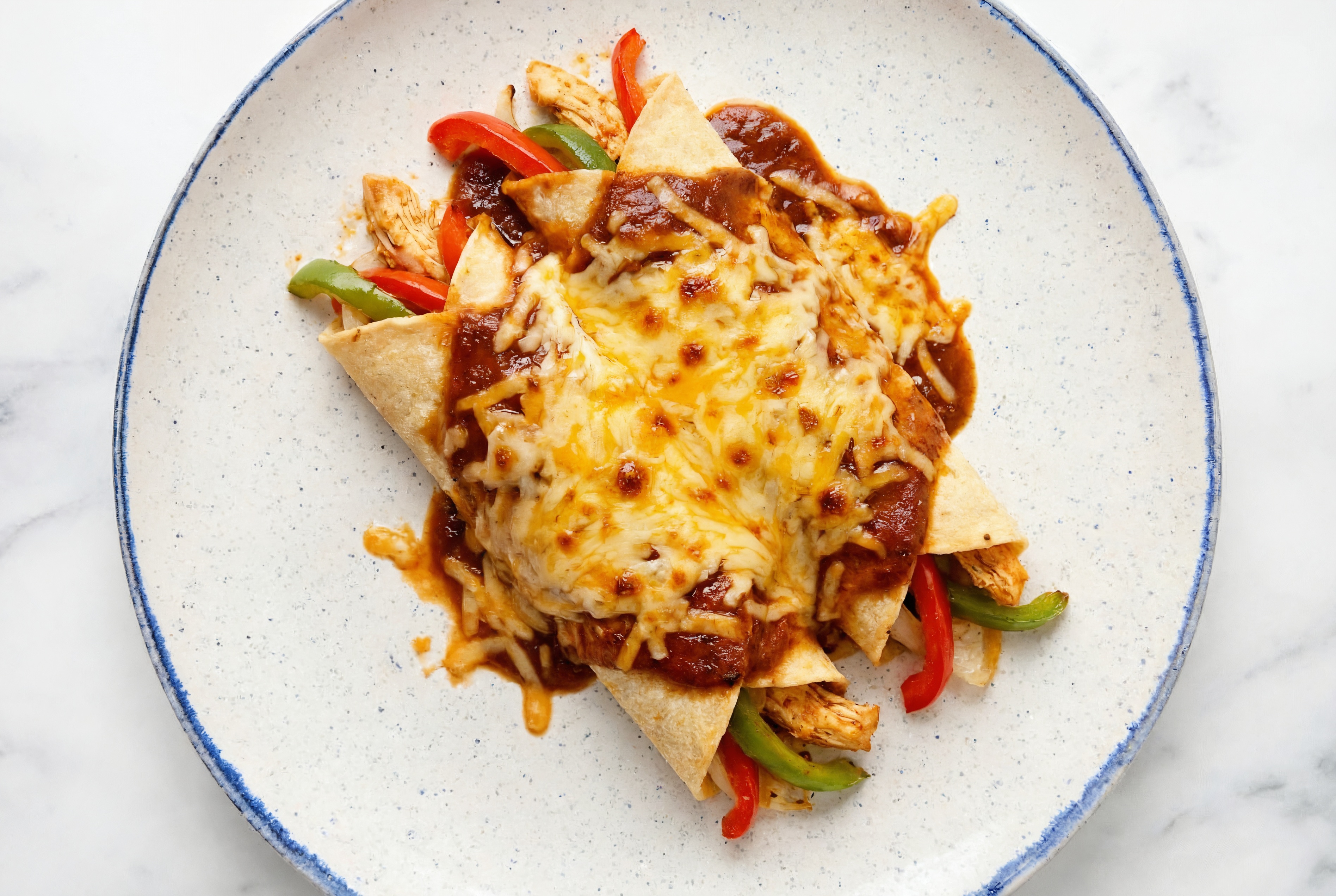 Savory Keto-Friendly Chicken Enchiladas Rojas with Shredded Sharp Cheddar Cheese