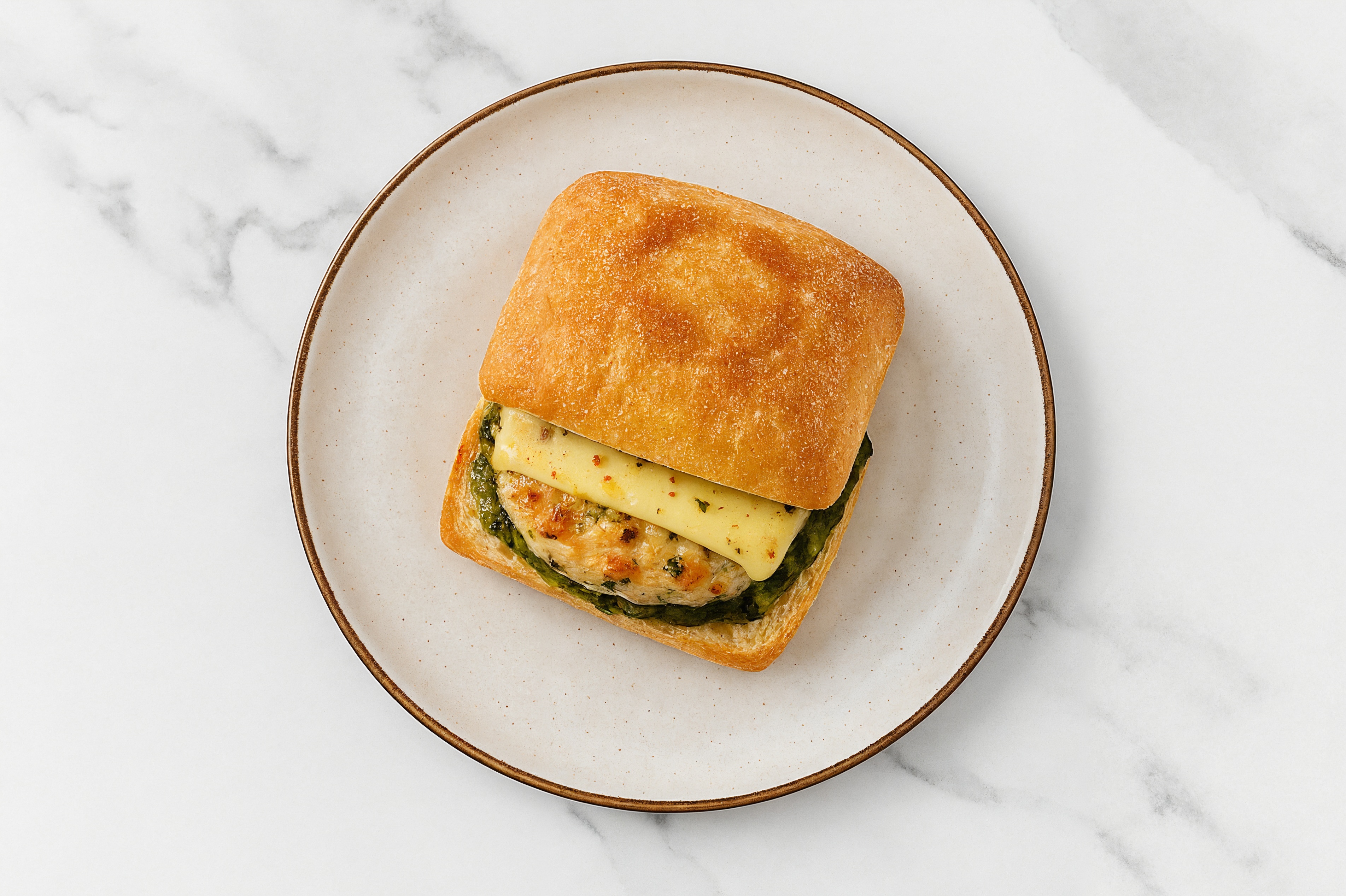 Garlic Chicken Burger on Ciabatta with Spinach Pesto & Pepper Jack