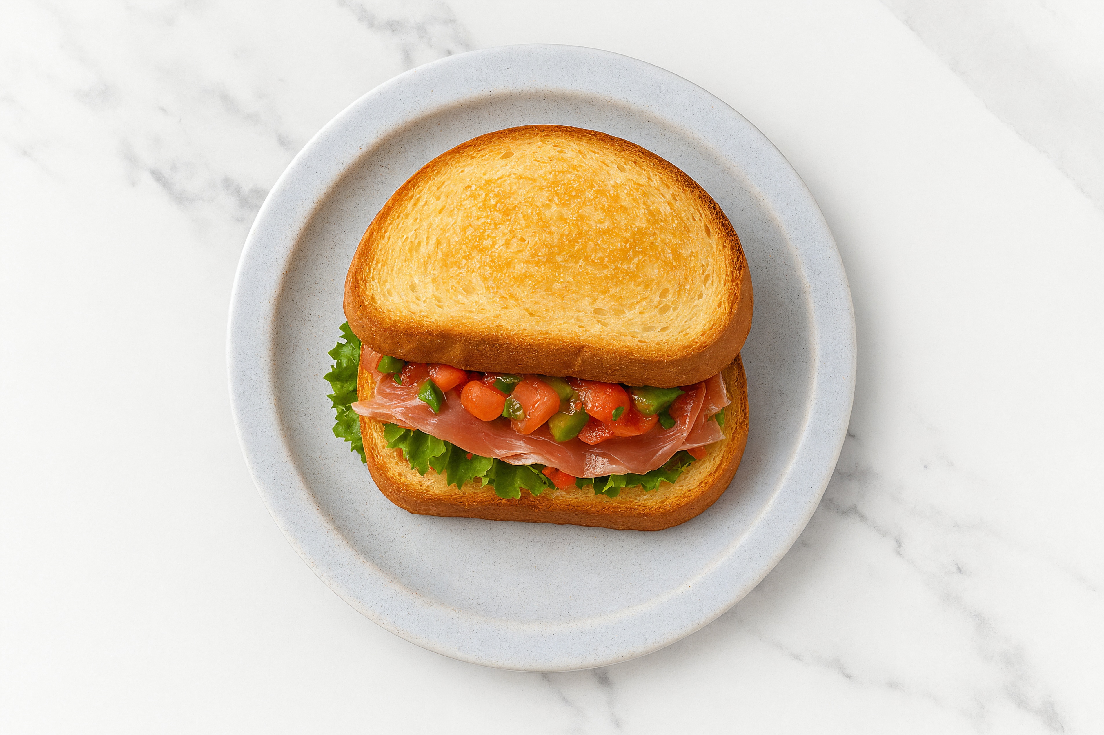 Mexican Prosciutto Sandwich with Green Leaf Lettuce on Honey White Bread