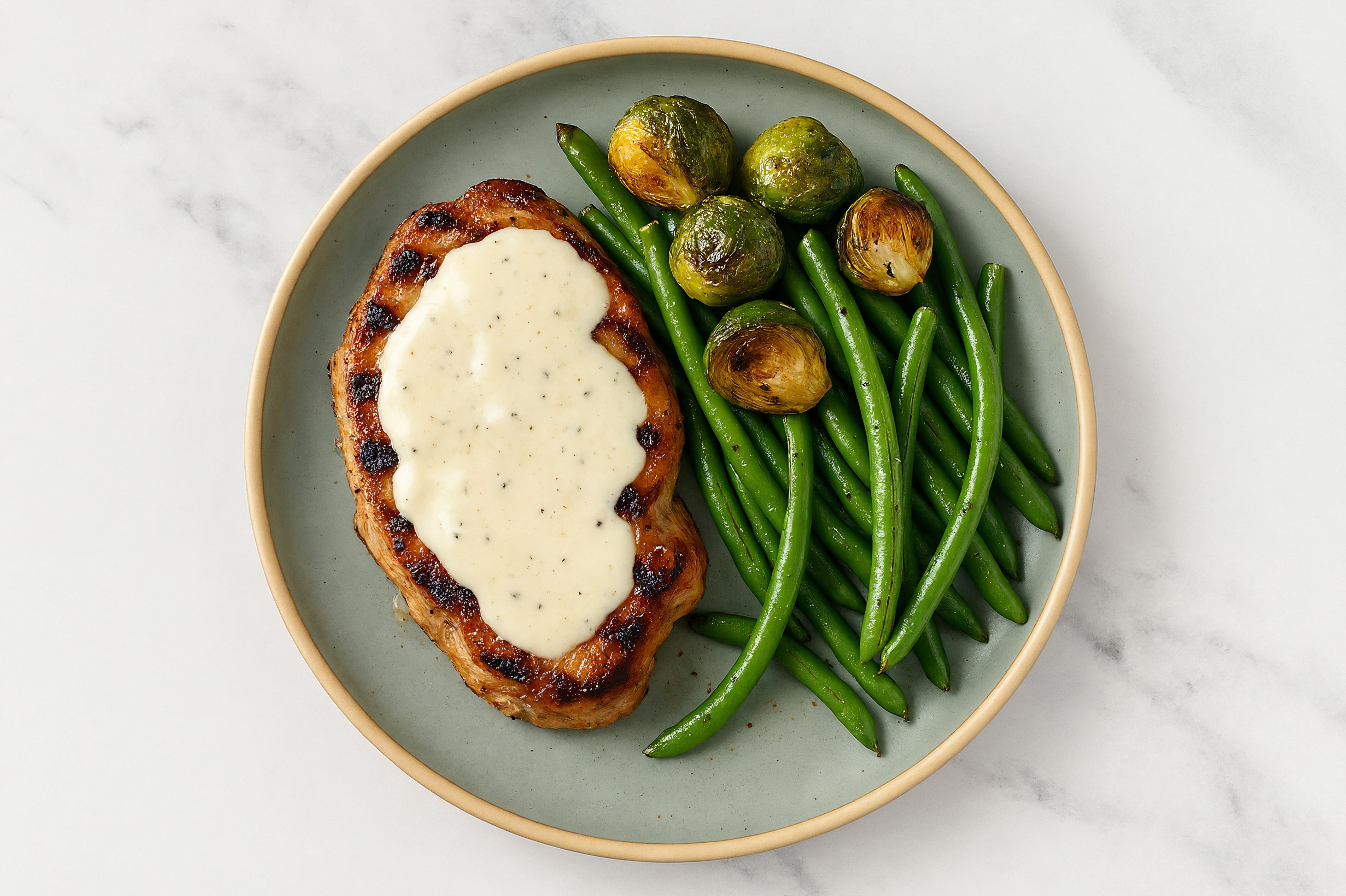 Creamy Parmesan Smothered Pork Chops with Green Beans & Roasted Brussels