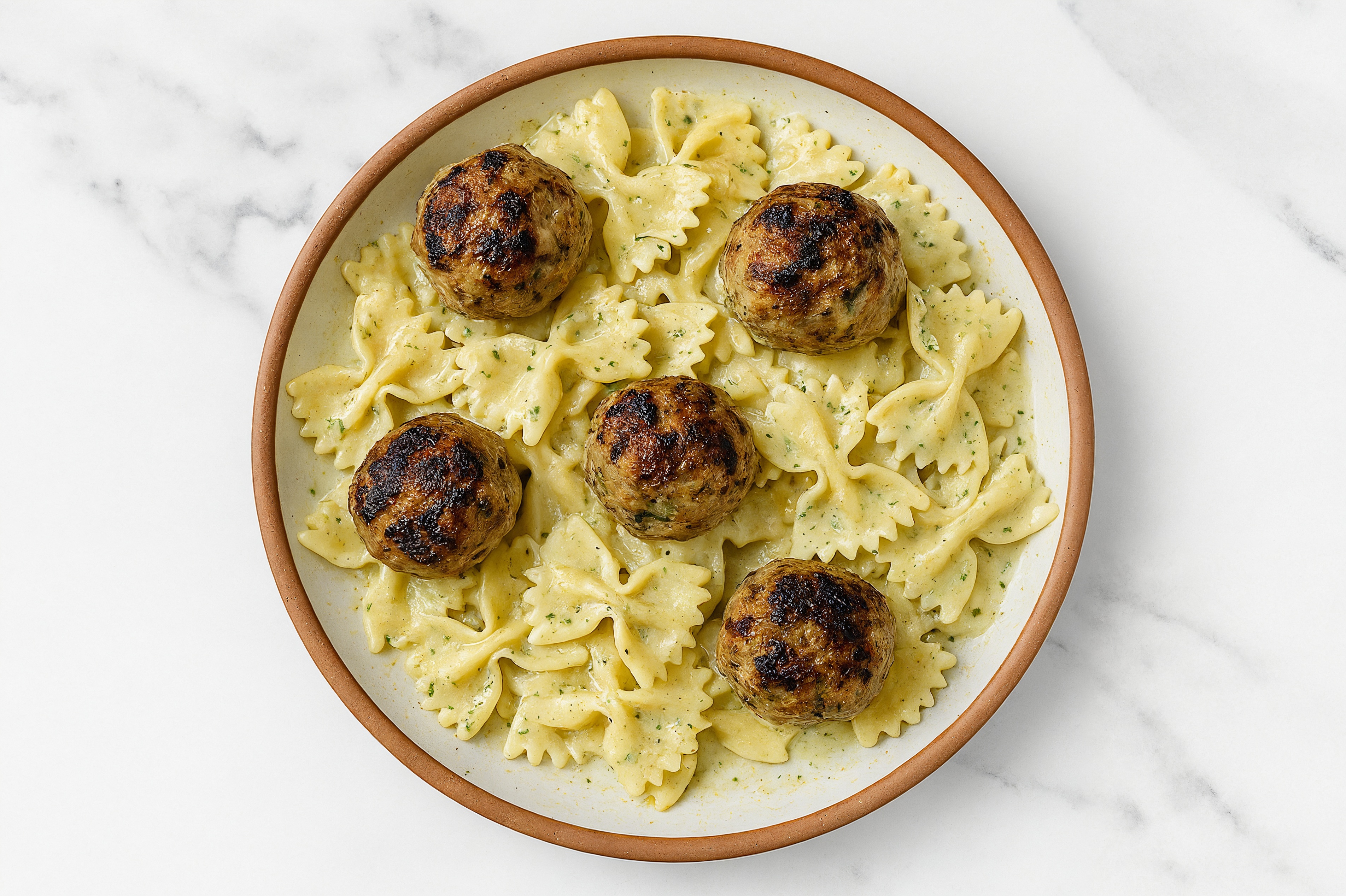 Herb Cream Bowtie Pasta with Meatballs