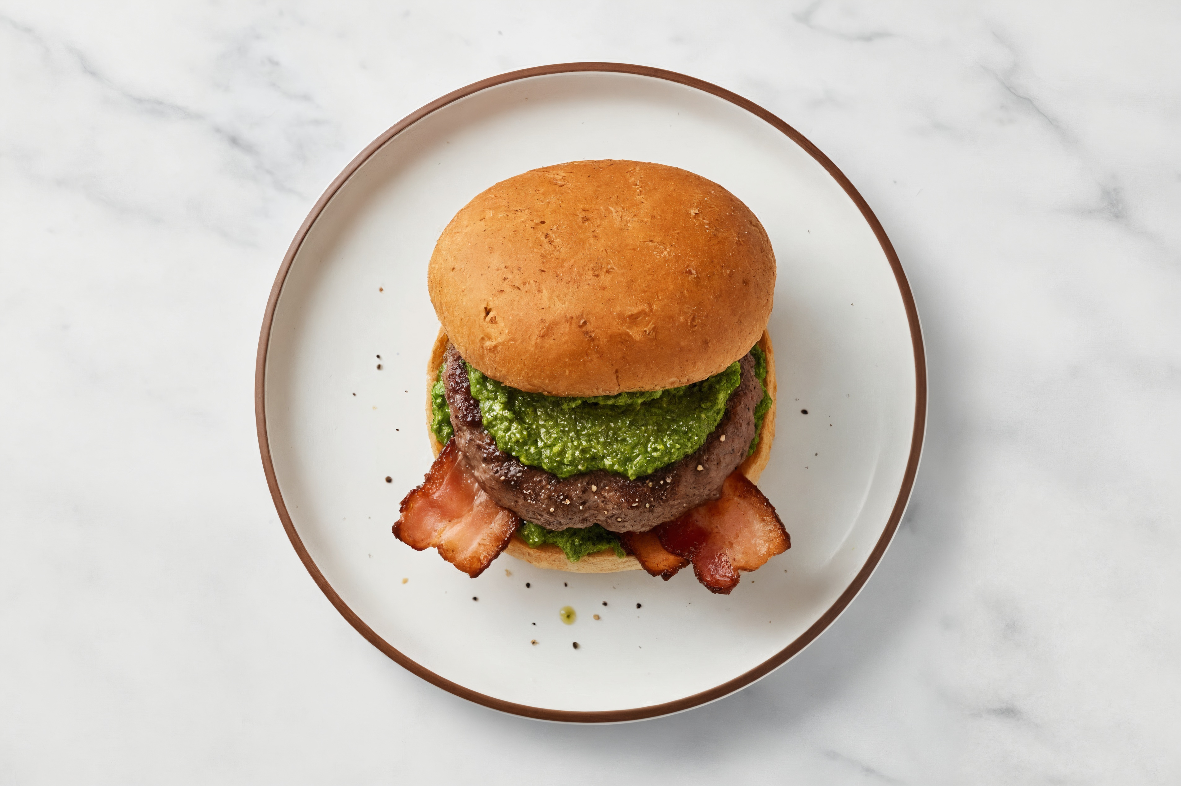 Beef Burger on Sprouted Grain with Spinach Pesto & Turkey Bacon