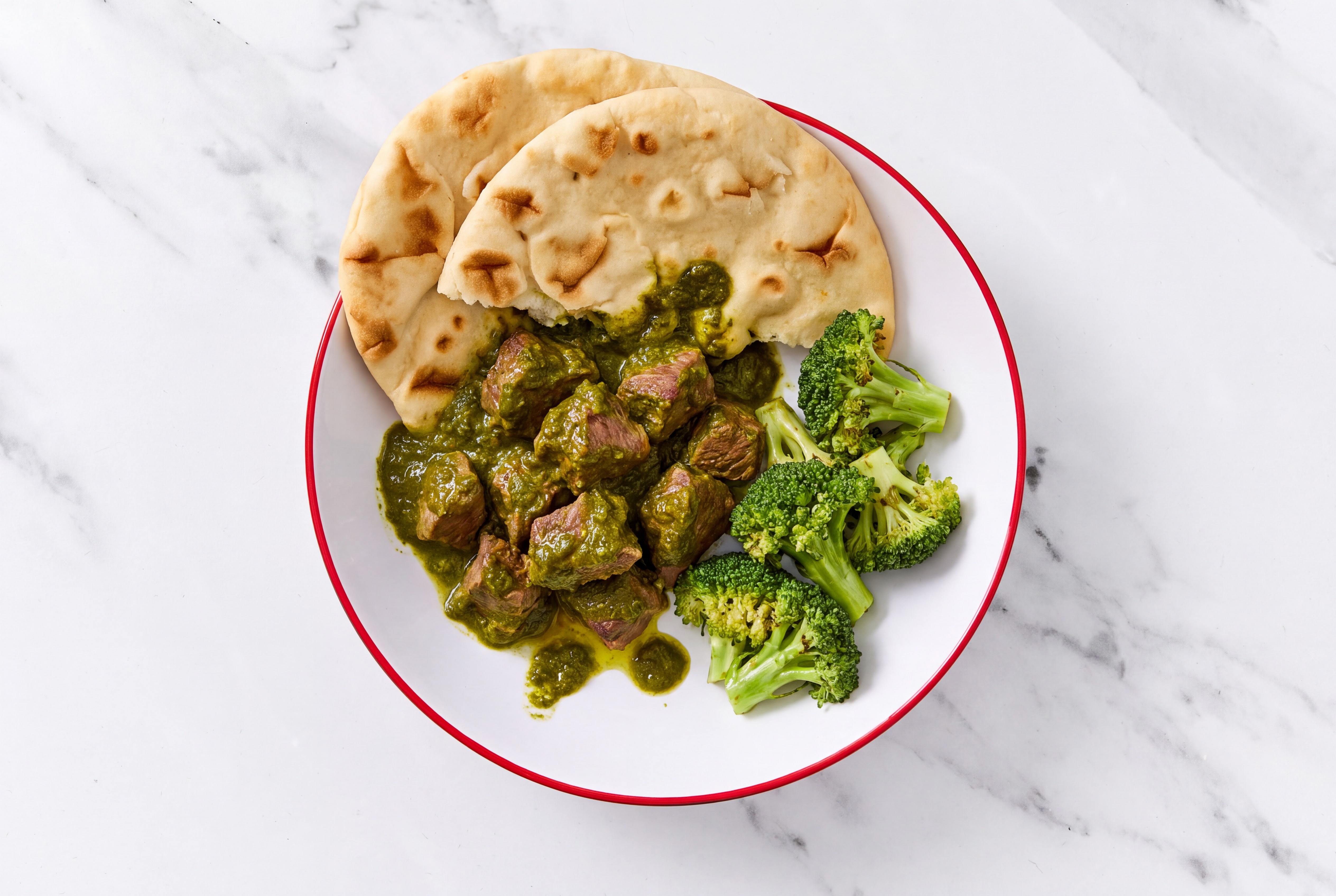 Lamb Saag + Naan with Broccoli Florets