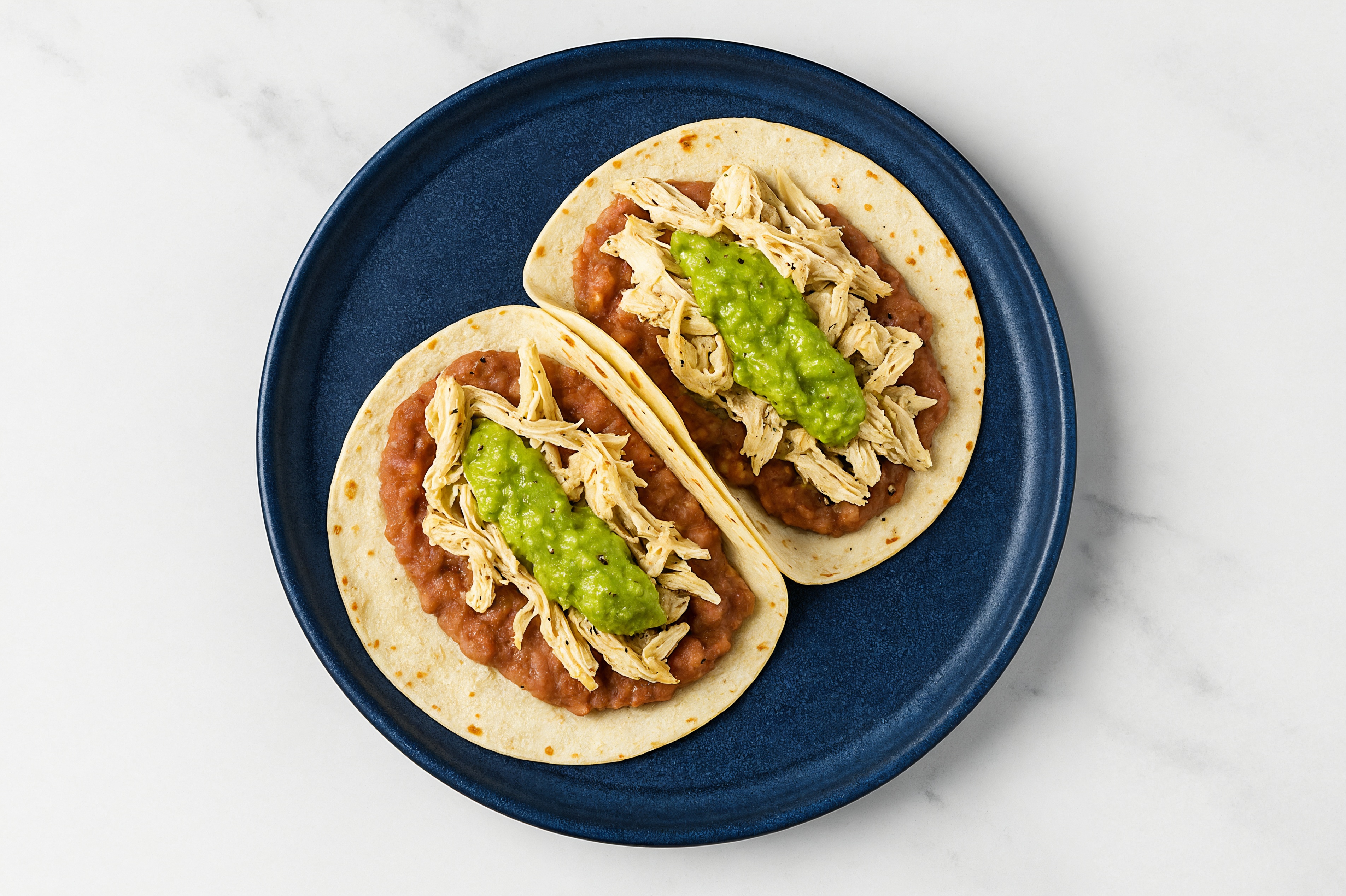  Pulled Chicken Tacos with Guacamole & Refried Red Beans