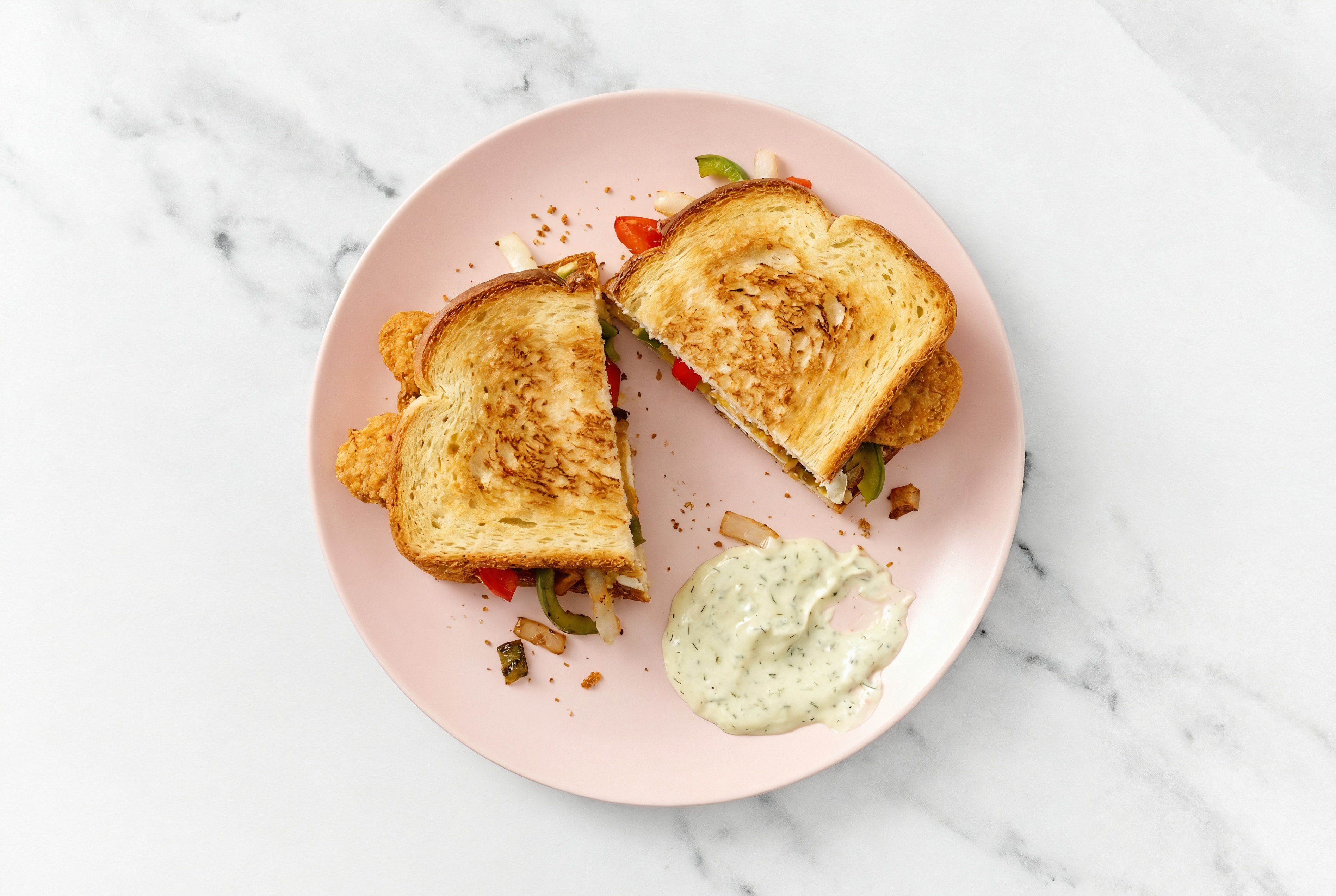 Dill Pickle "Chicken" Tenders Sandwich with Peppers + Onion on Honey White Bread