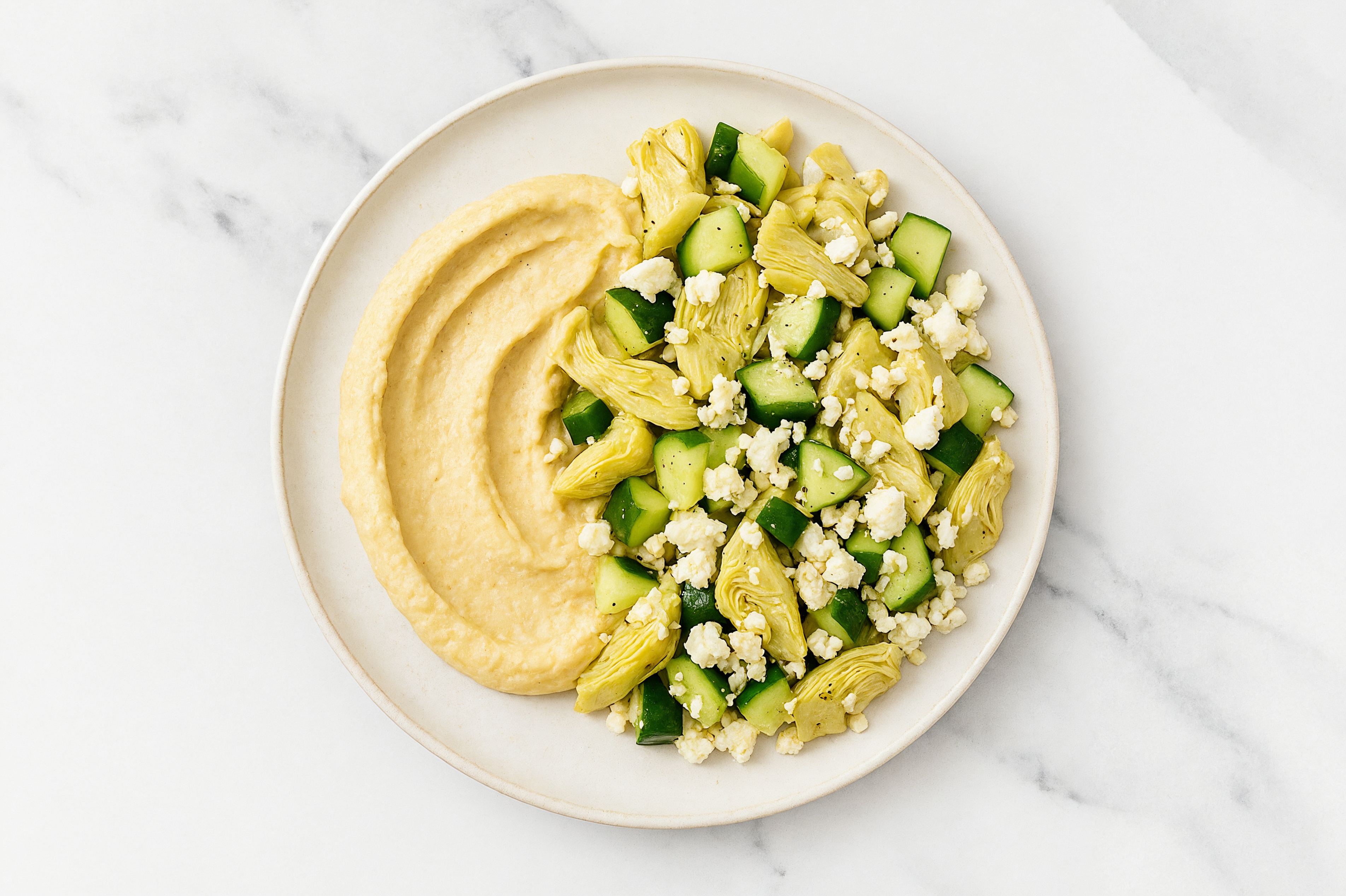 Feta Artichoke Cucumber Bowl over Lemon Garlic Hummus