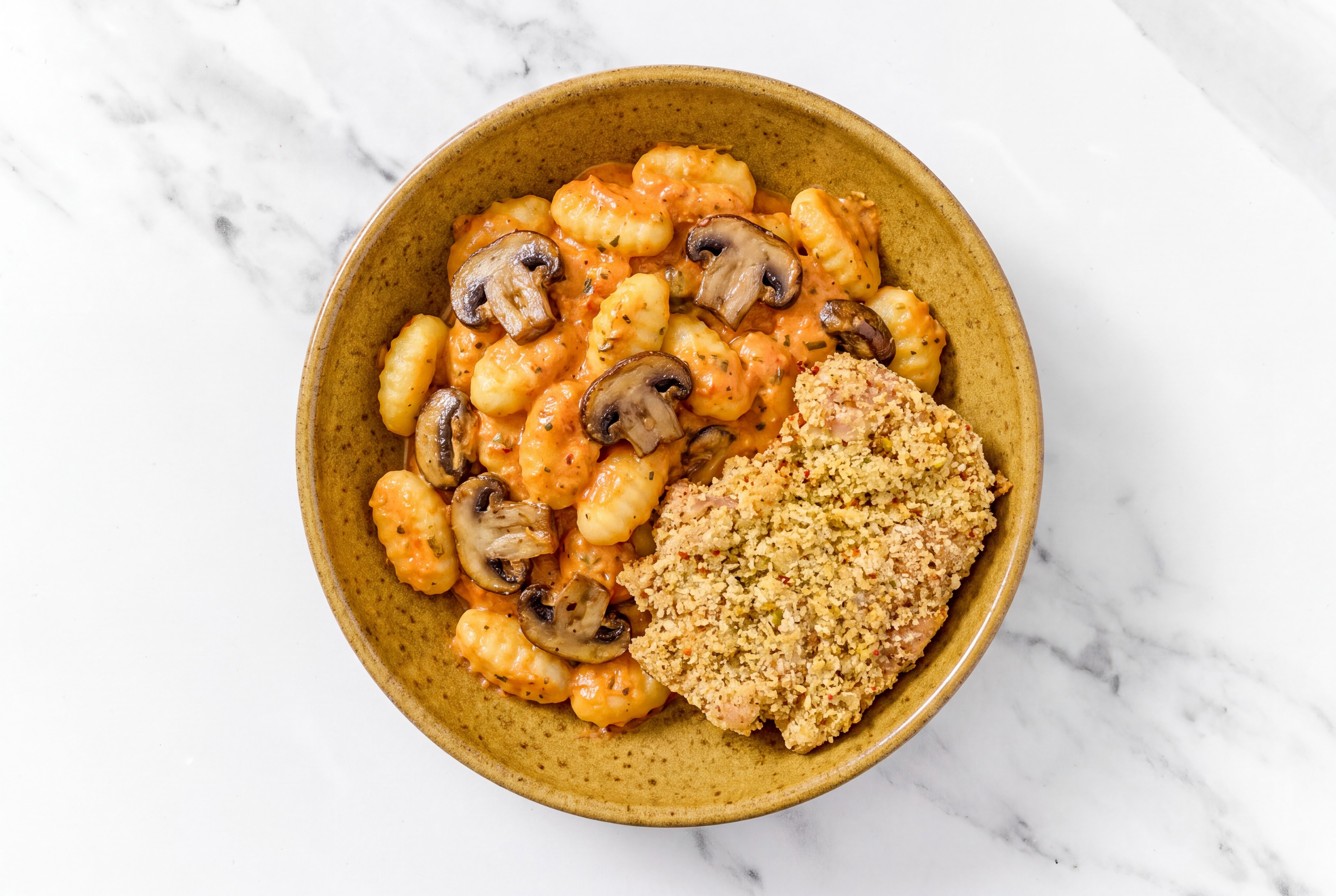 Crispy Garlic Chicken over Creamy Vodka Gnocchi with Baby Bella Mushrooms