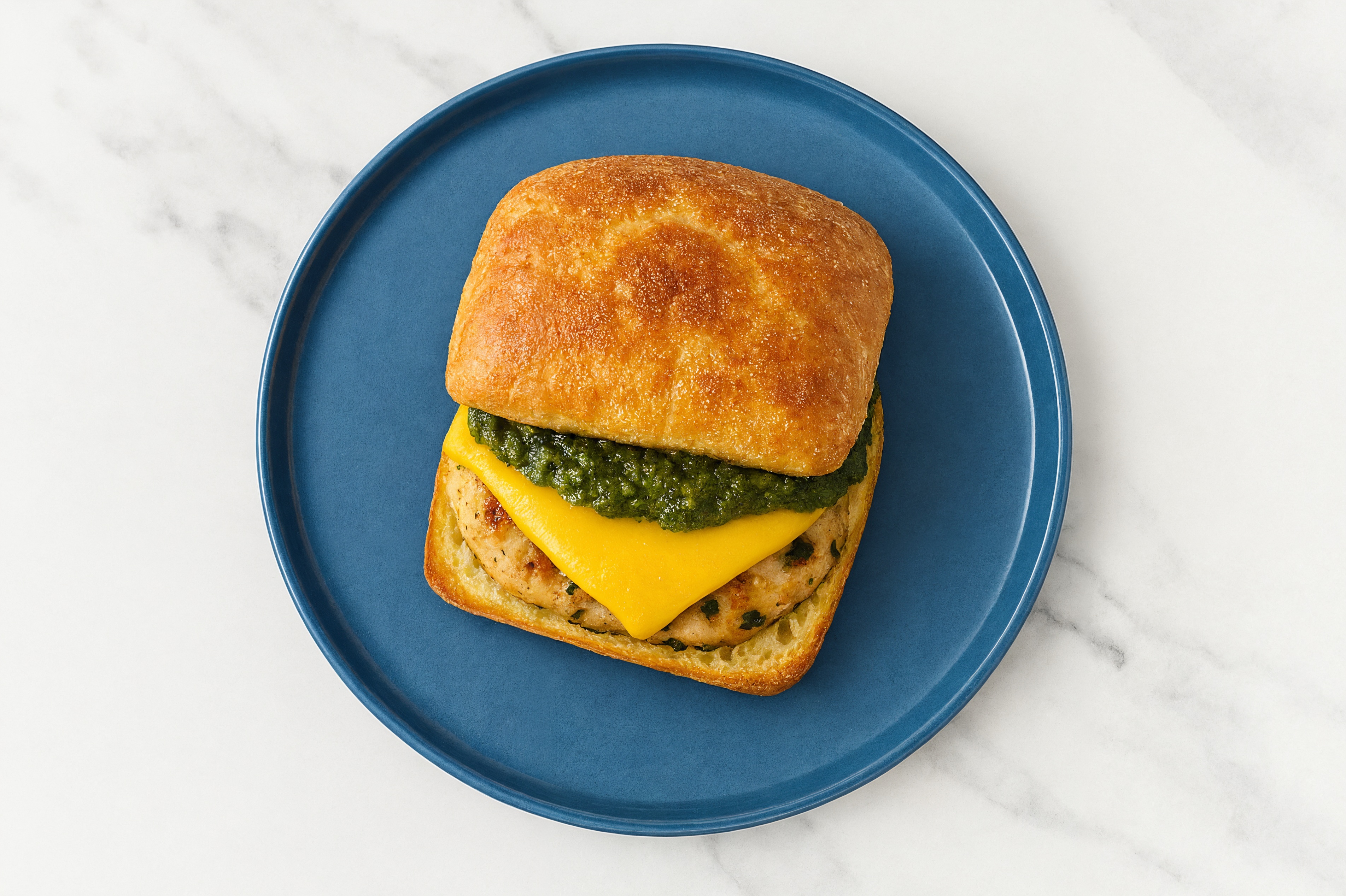 Garlic Chicken Burger on Ciabatta with Spinach Pesto & American