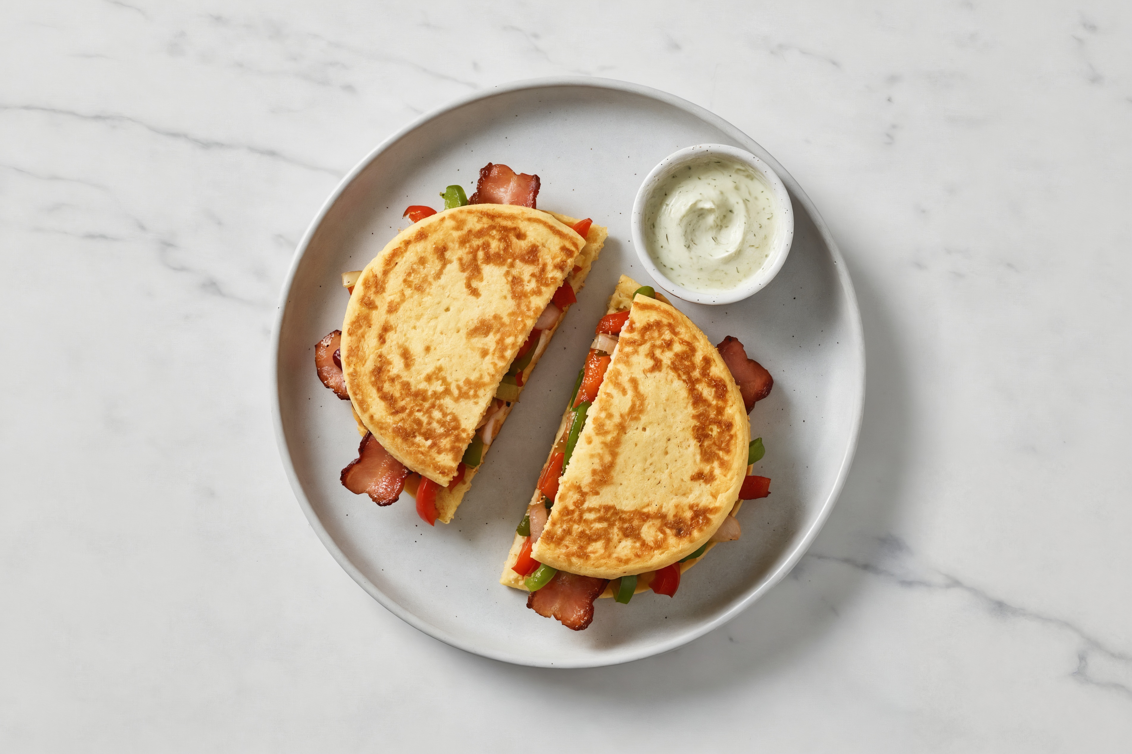 Dill Pickle Turkey Bacon Sandwich with Peppers + Onion on Cauliflower Rounds