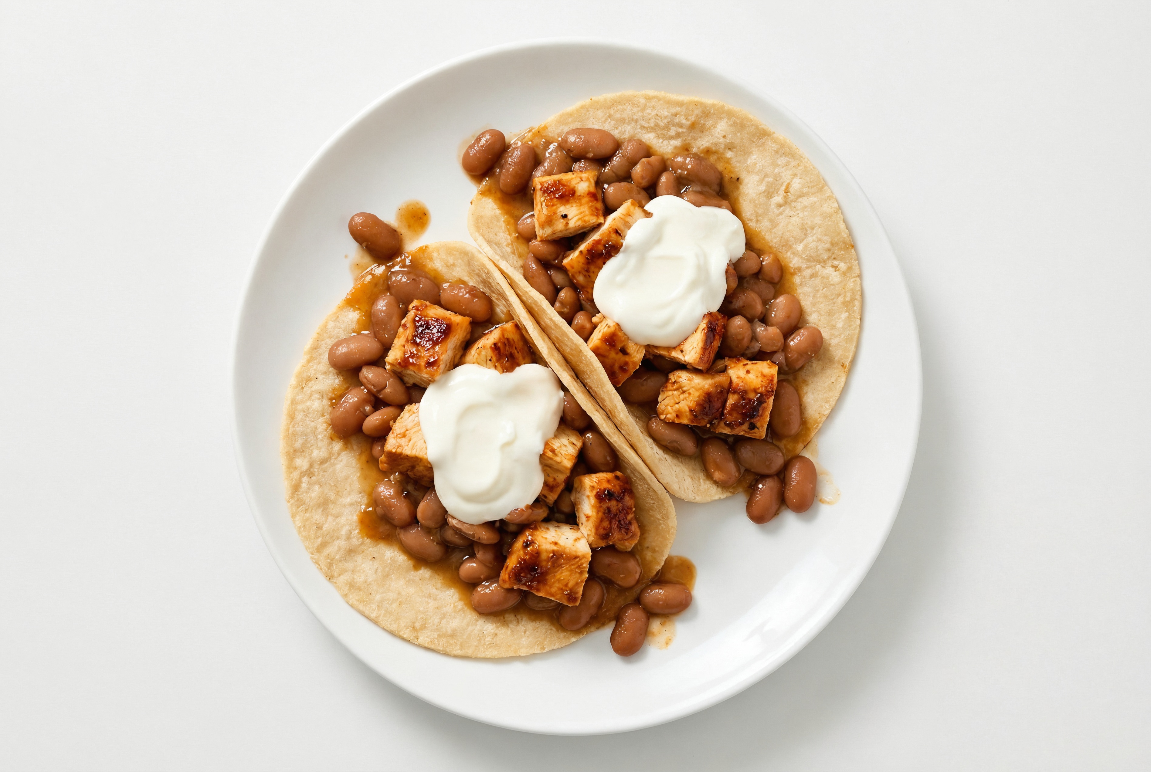 Chipotle Chicken Tacos with Crema & Pinto Beans