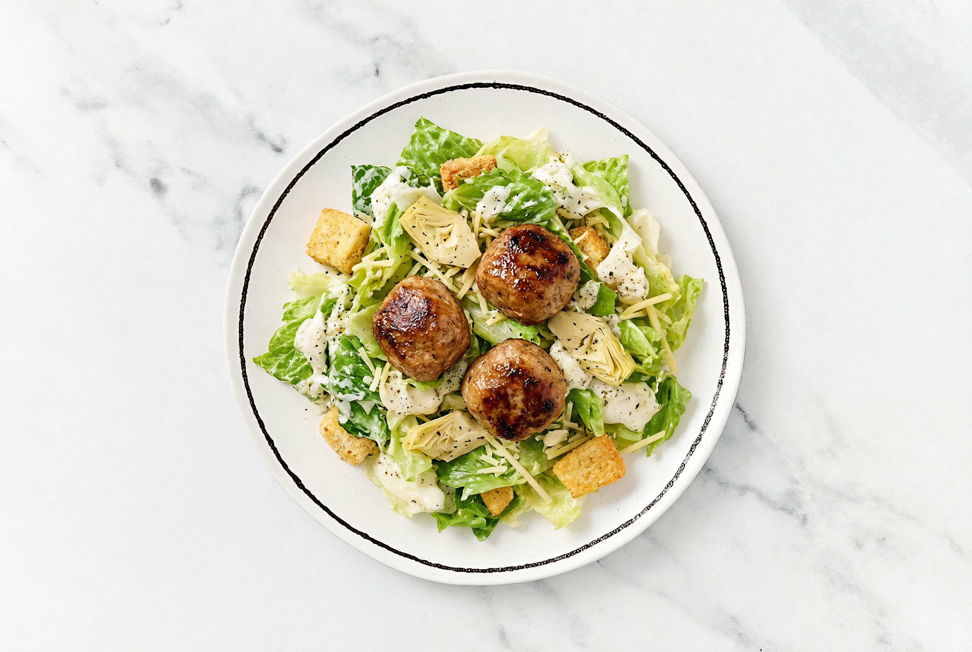 Caesar Salad Bowl with Meatballs + Marinated Artichoke Hearts
