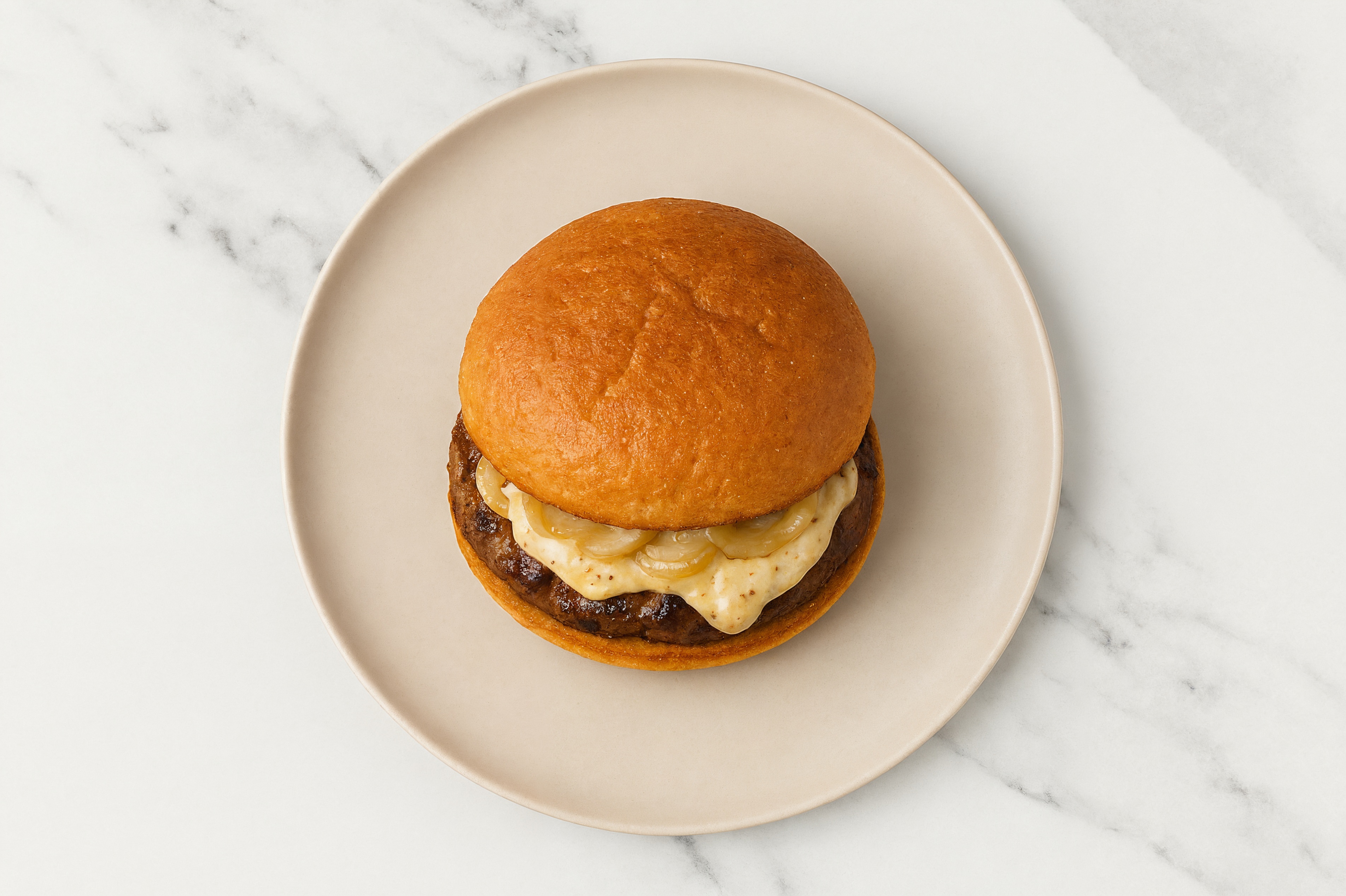 Caramelized Onion Tavern Beef Burger on GF Bun with French Onion Sauce