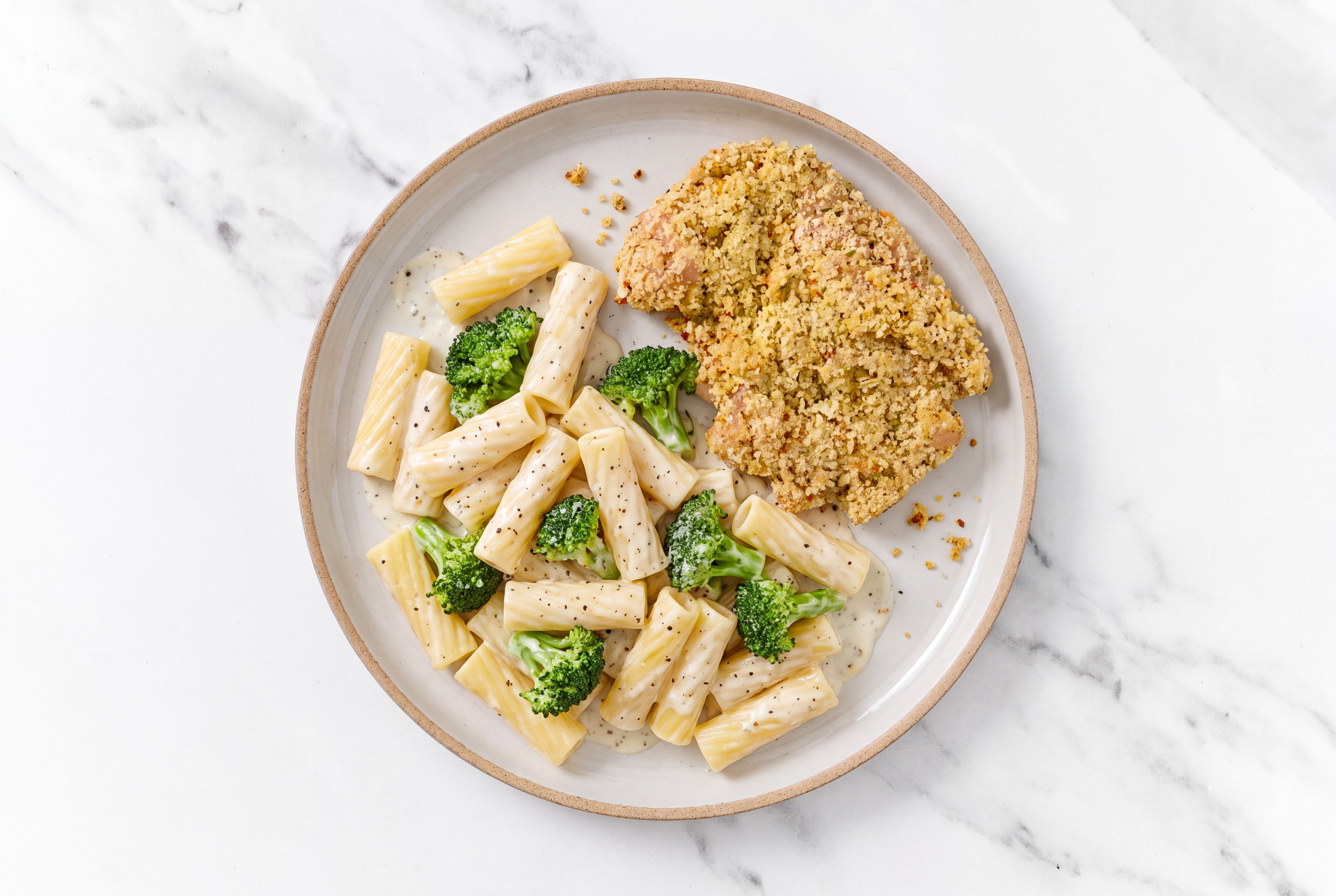 Crispy Garlic Chicken over Alfredo Rigatoni with Broccoli
