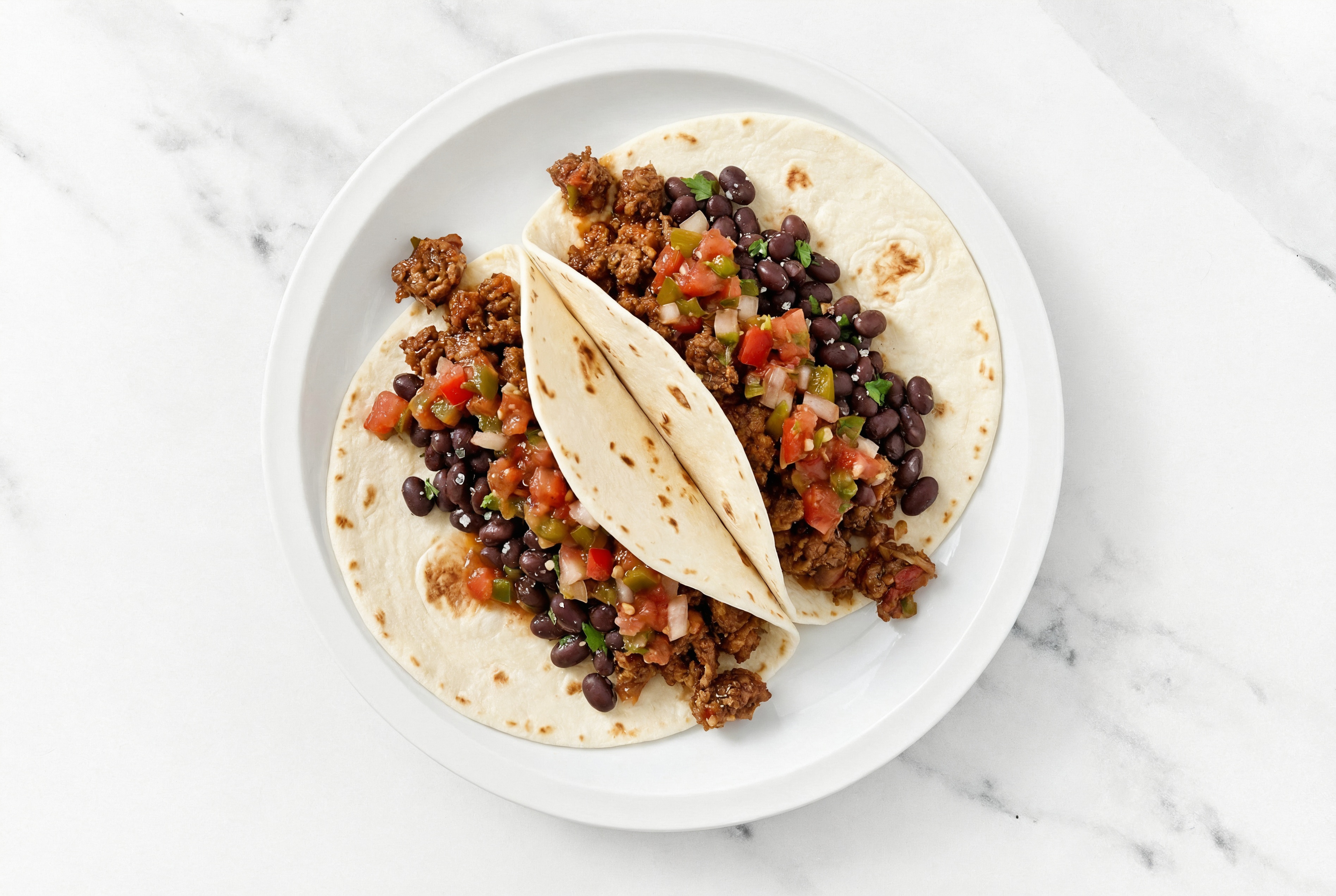 Zesty Mexican-Style Ground Beef Tacos with Pico De Gallo & Spiced Beans