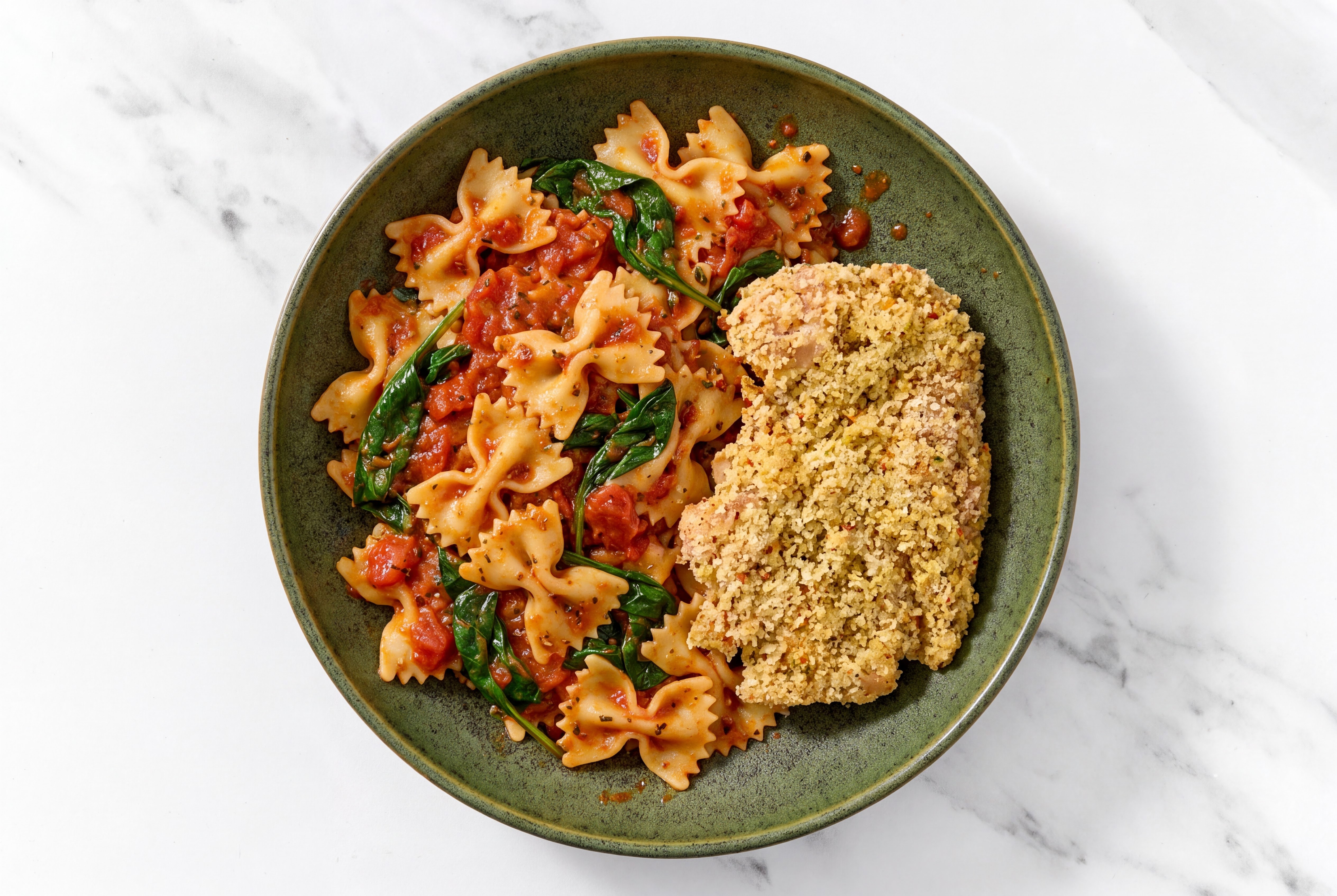 Crispy Garlic Chicken over Marinara Farfalle with Baby Spinach