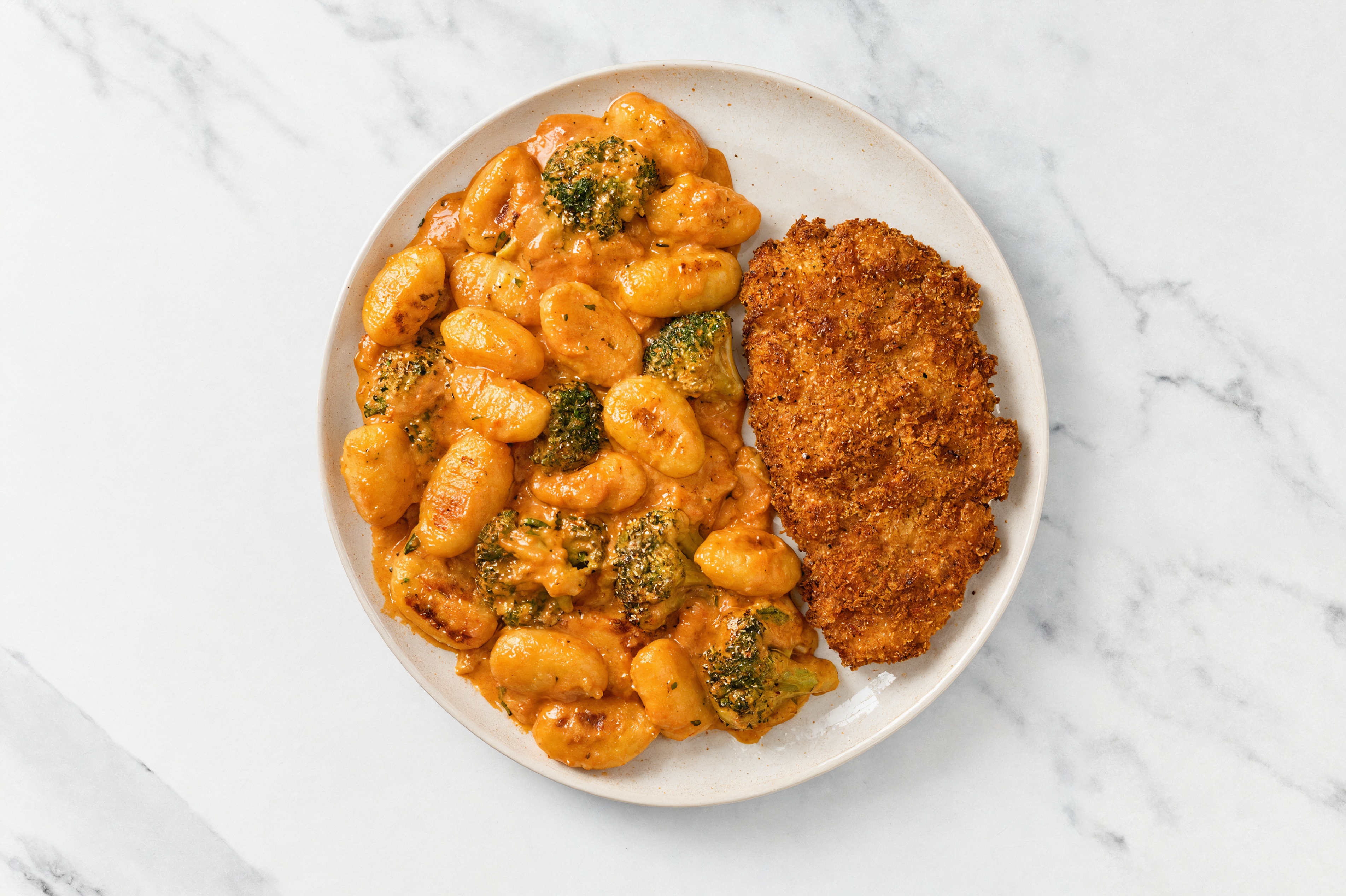 Crispy Hot Honey Chicken over Creamy Vodka Gnocchi with Broccoli