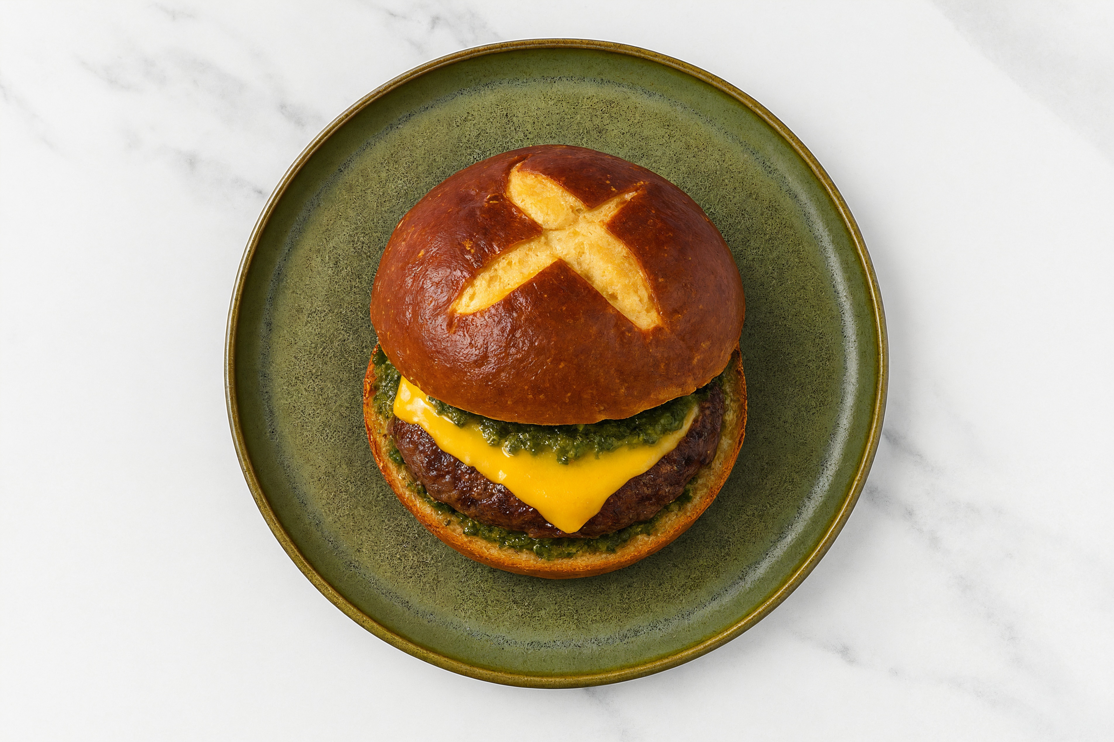Lamb Burger on Pretzel with Spinach Pesto & American