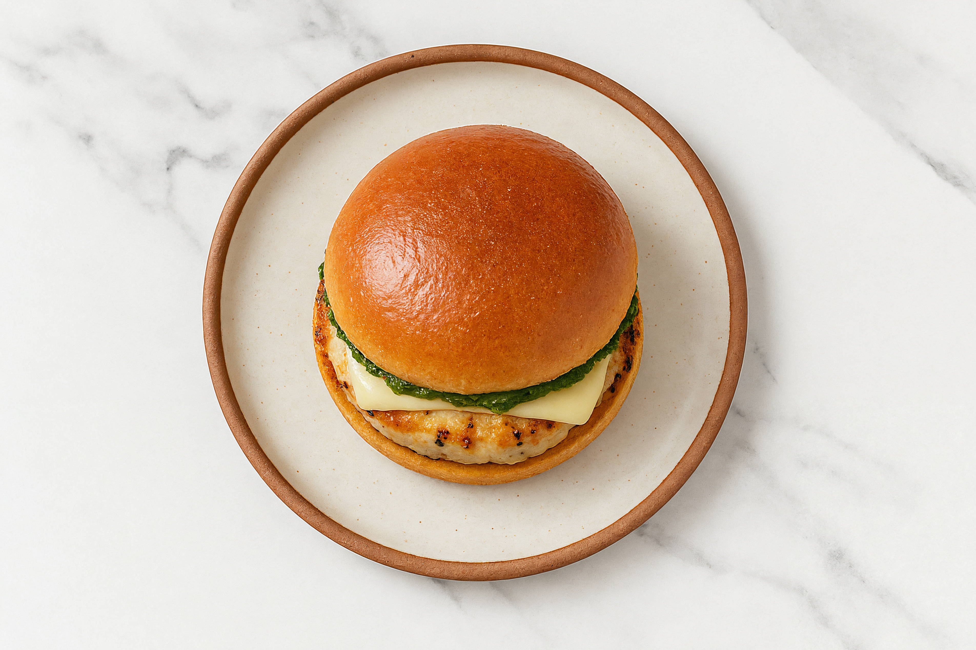 Garlic Chicken Burger on Brioche with Spinach Pesto & Swiss