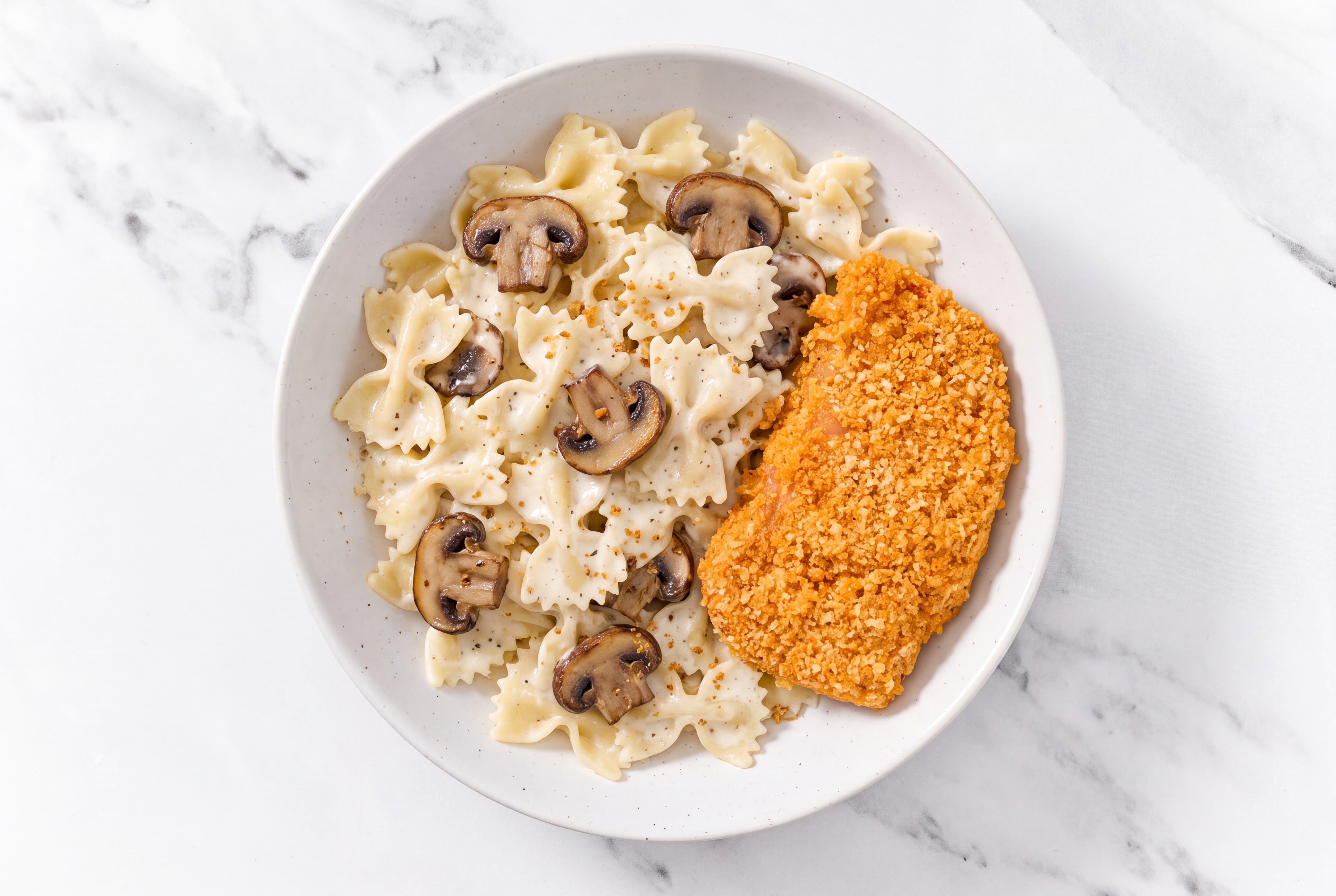 Crispy Hot Honey Chicken over Alfredo Farfalle with Baby Bella Mushrooms