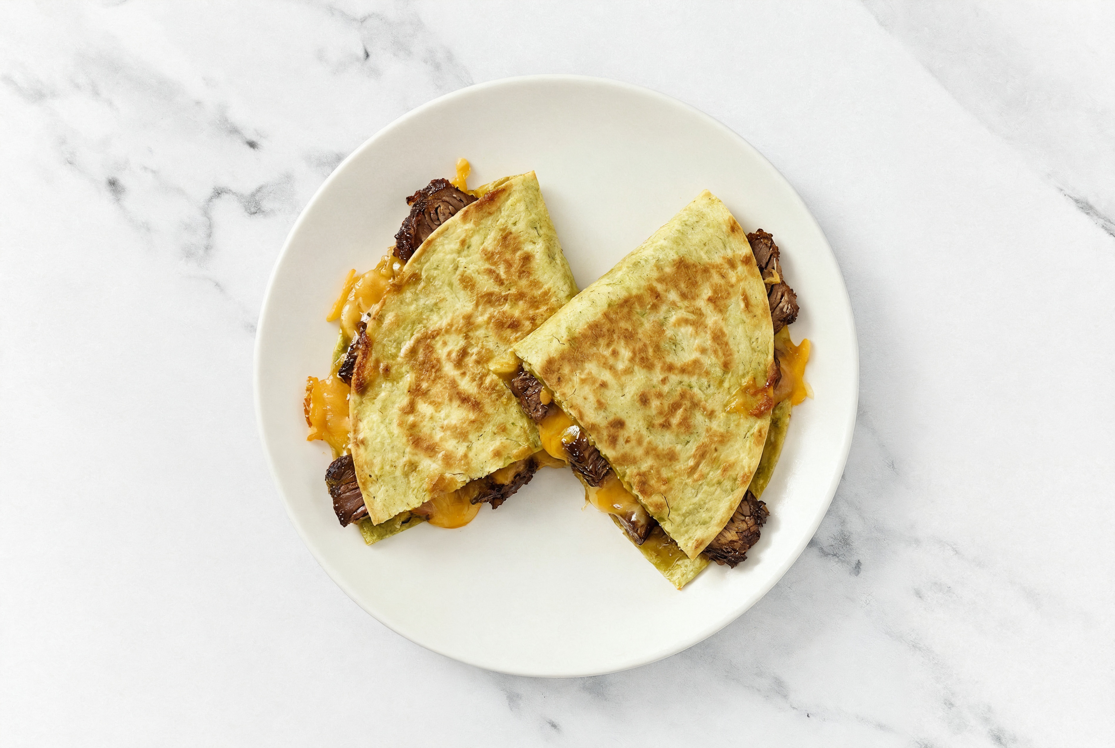 Herby Beef Short Rib Quesadillas with Shredded Sharp Cheddar Cheese