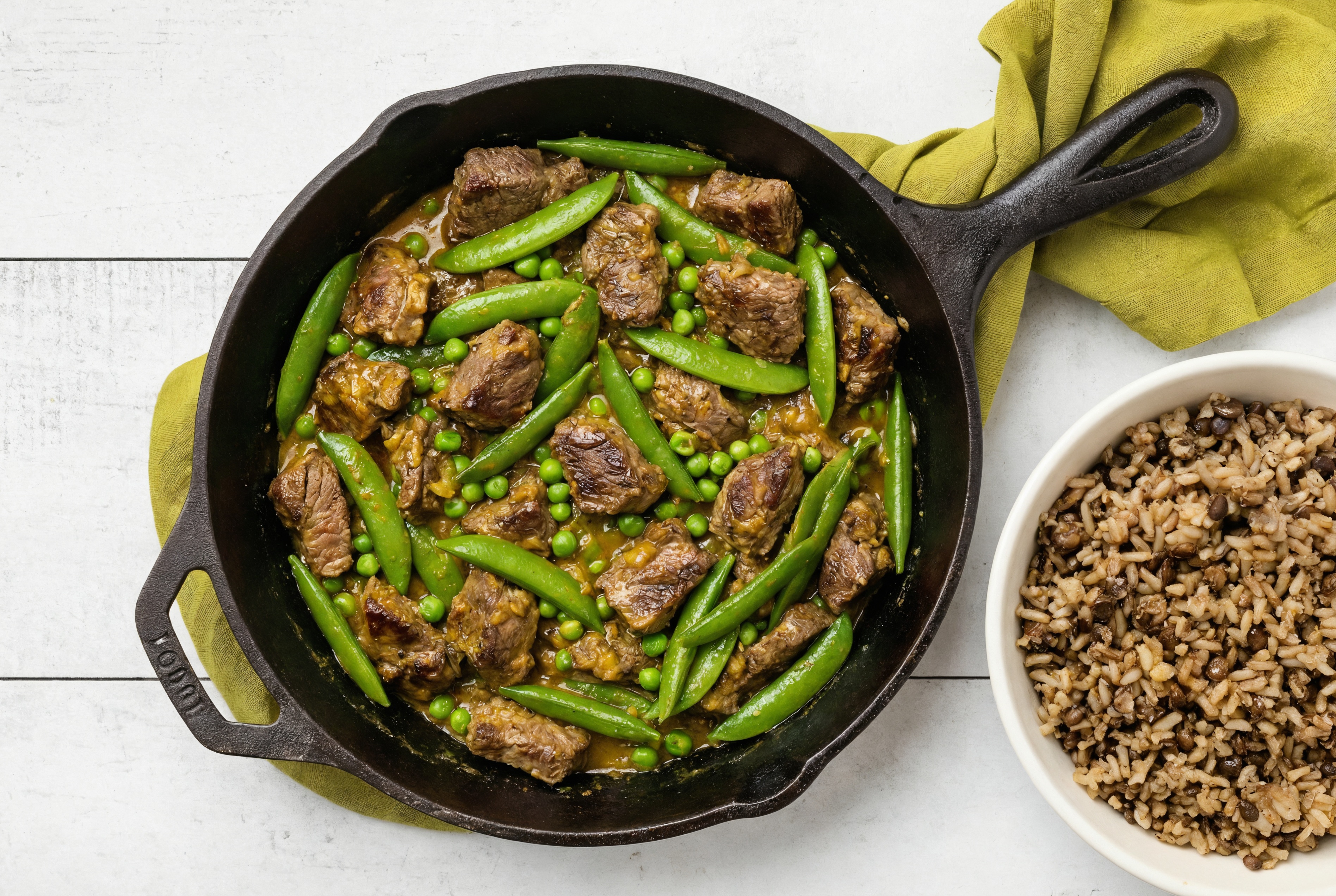 Coconut Curry Beef Stir-Fry with Snap Peas over Quinoa