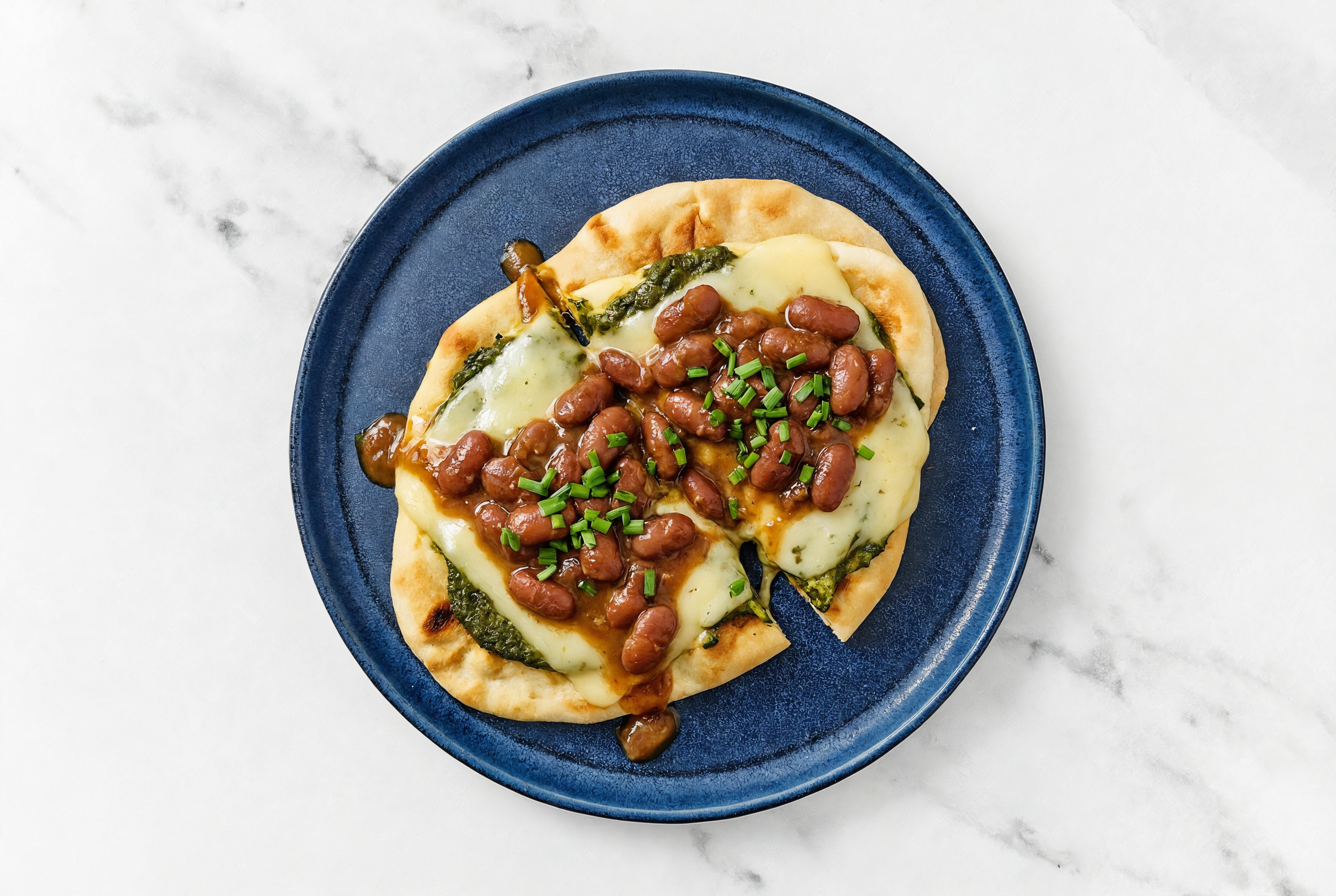 Saag Sauce Creole Bean Naan Pizza with Mild Havarti + Fresh Chives