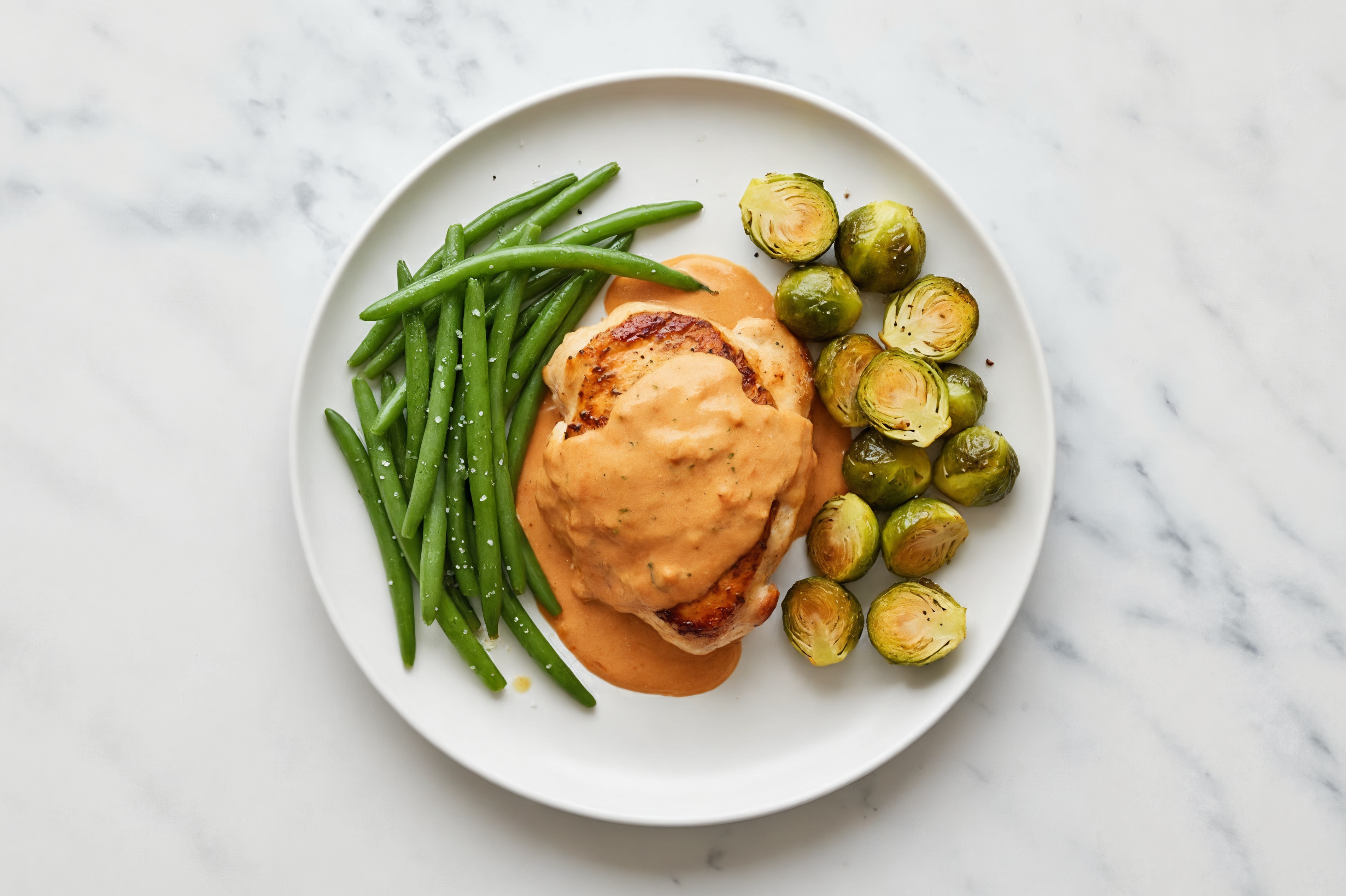 Creamy Vodka Smothered Chicken Thighs with Green Beans & Roasted Brussels