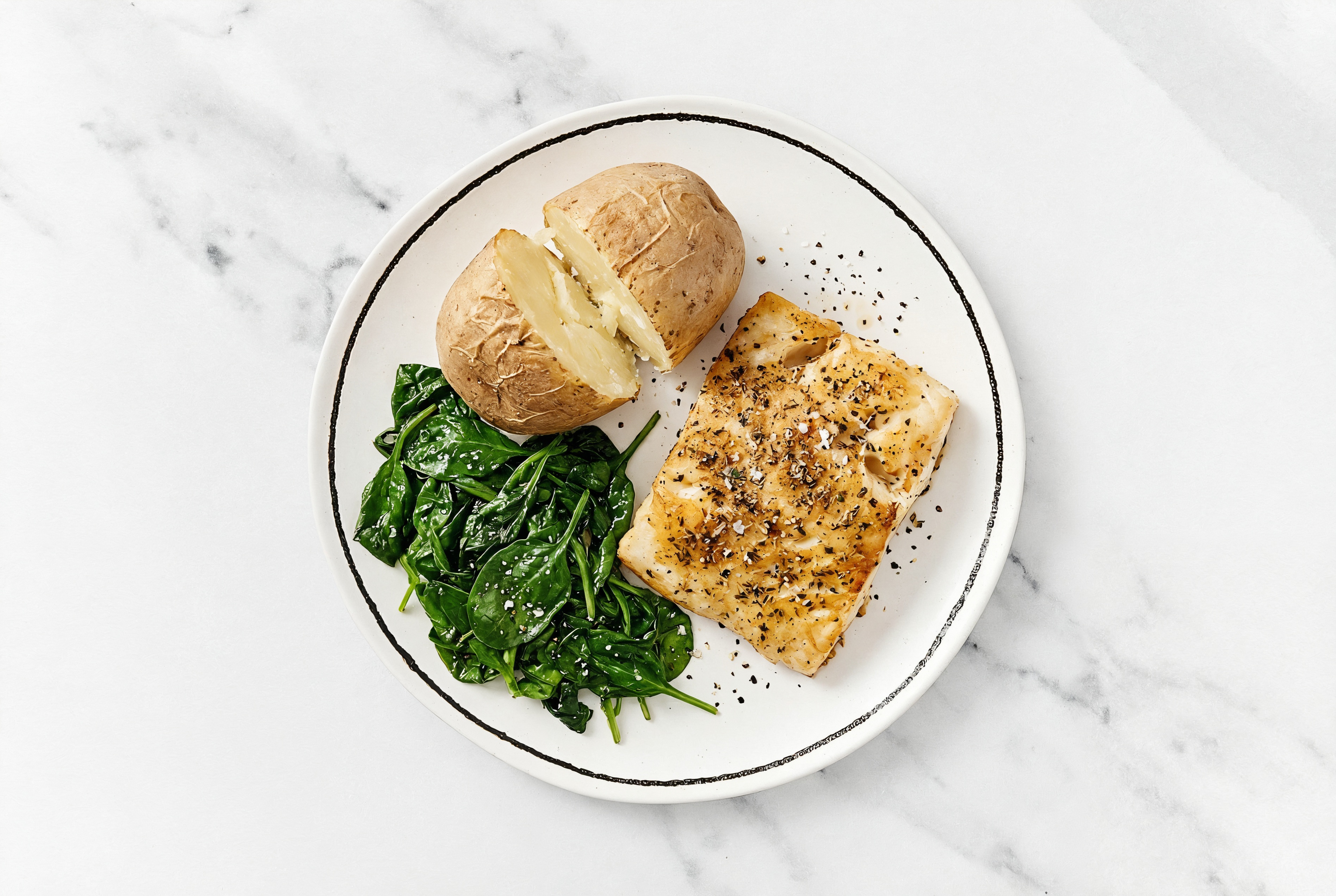 Roasted Honey Herb Barramundi with Sautéed Baby Spinach