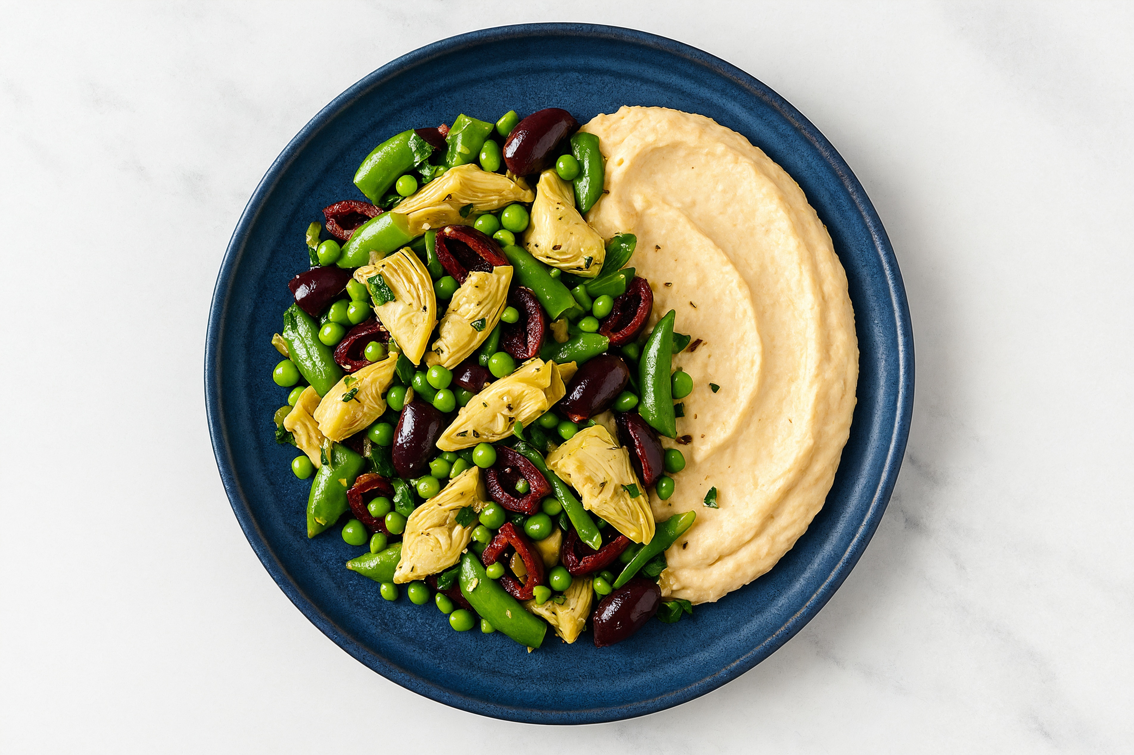 Olive Artichoke Snap Pea Bowl over Lemon Garlic Hummus