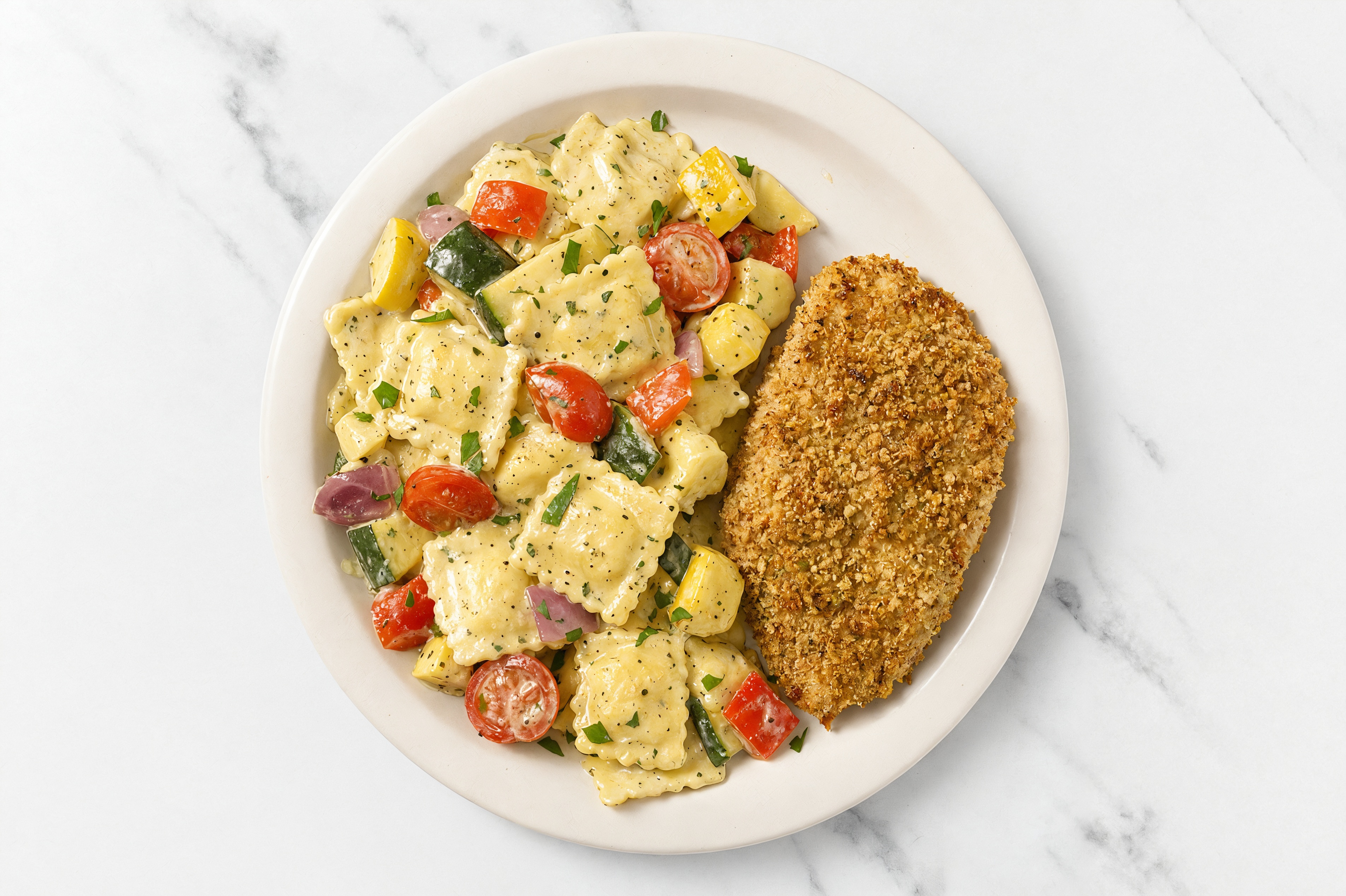 Crispy Garlic Chicken over Creamy Ravioli with Mixed Veggies