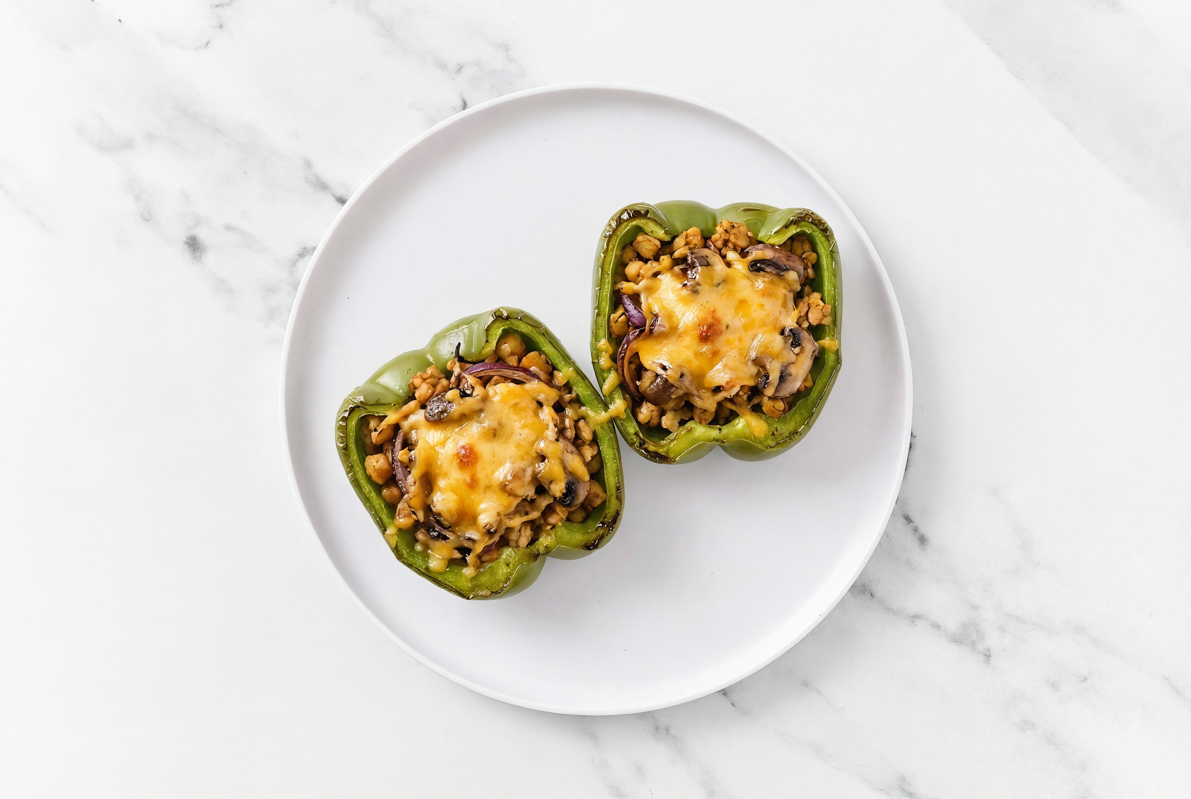 Cheesy Tempeh + Mushroom Stuffed Peppers with Shredded Sharp Cheddar Cheese