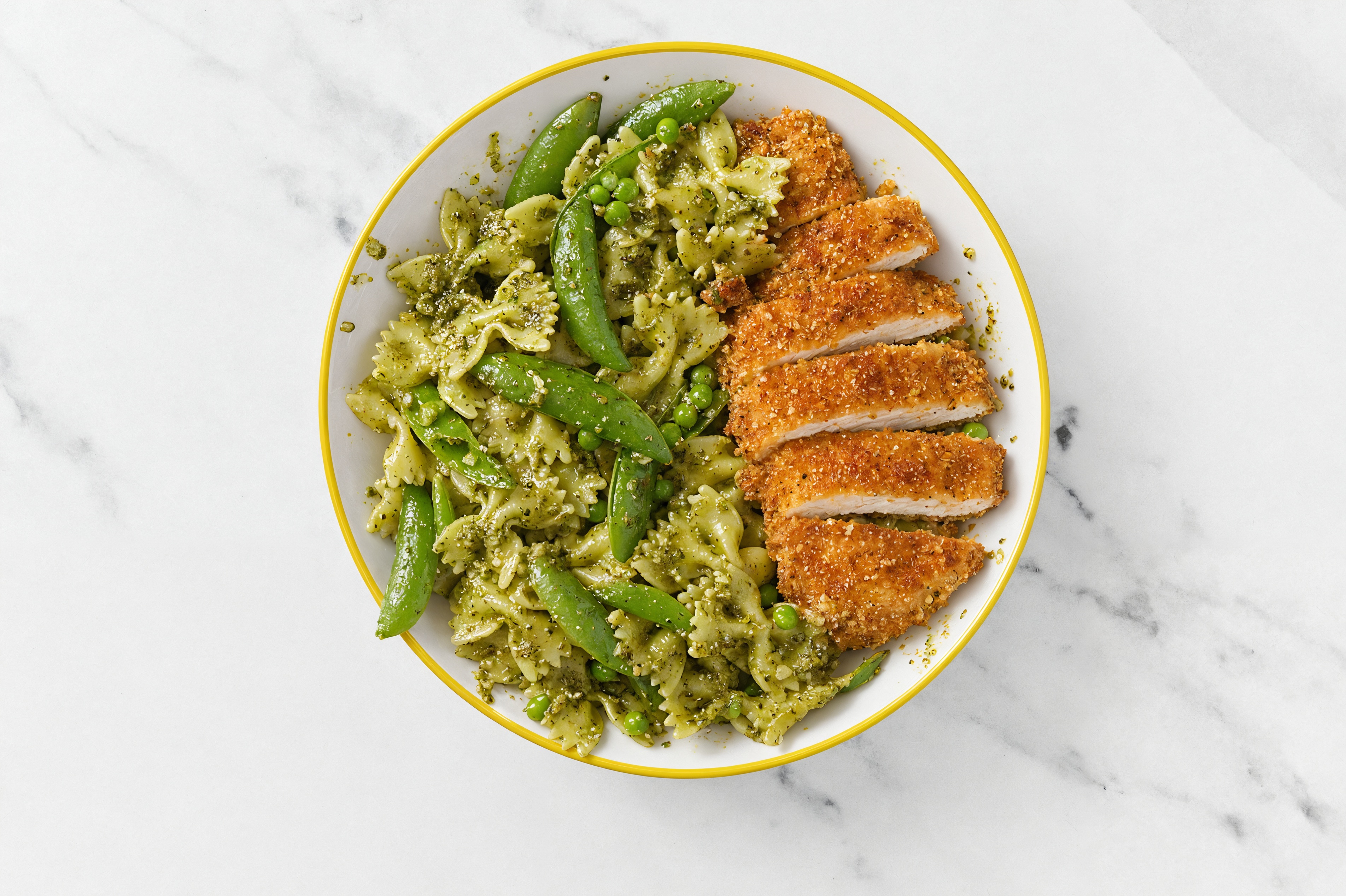 Crispy Hot Honey Chicken over Pesto Farfalle with Snap Peas